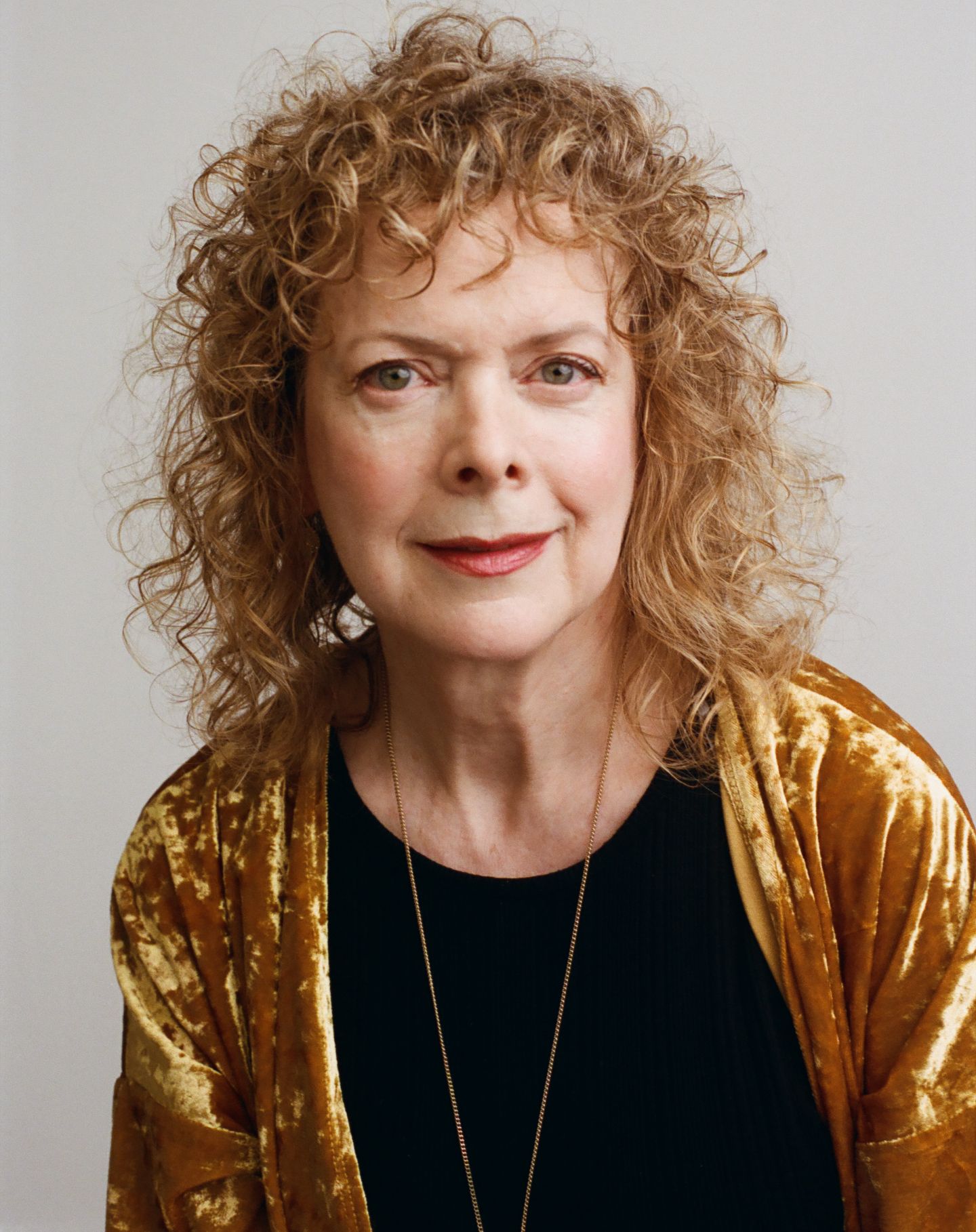 A woman in a black top and gold metallic jacket poses against a light background in a four-panel collage.