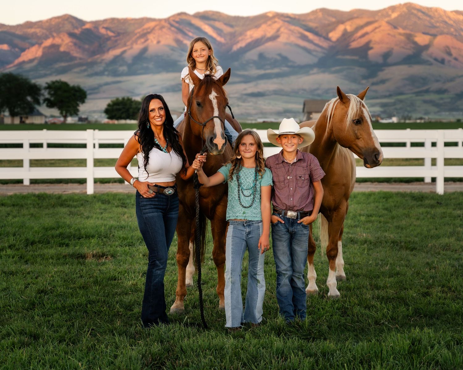 Family Session. Preston, Idaho with fall colors in a filed with horses.  Northern Utah Photographer