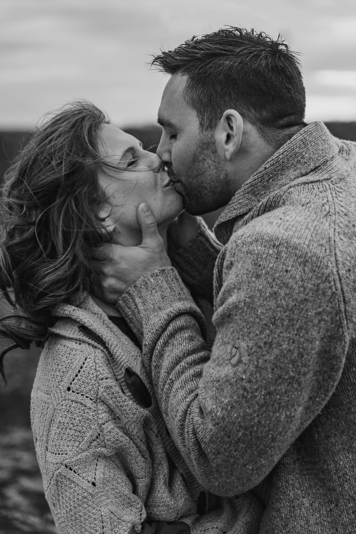 Intimate black and white portraits of a couple sharing tender moments.