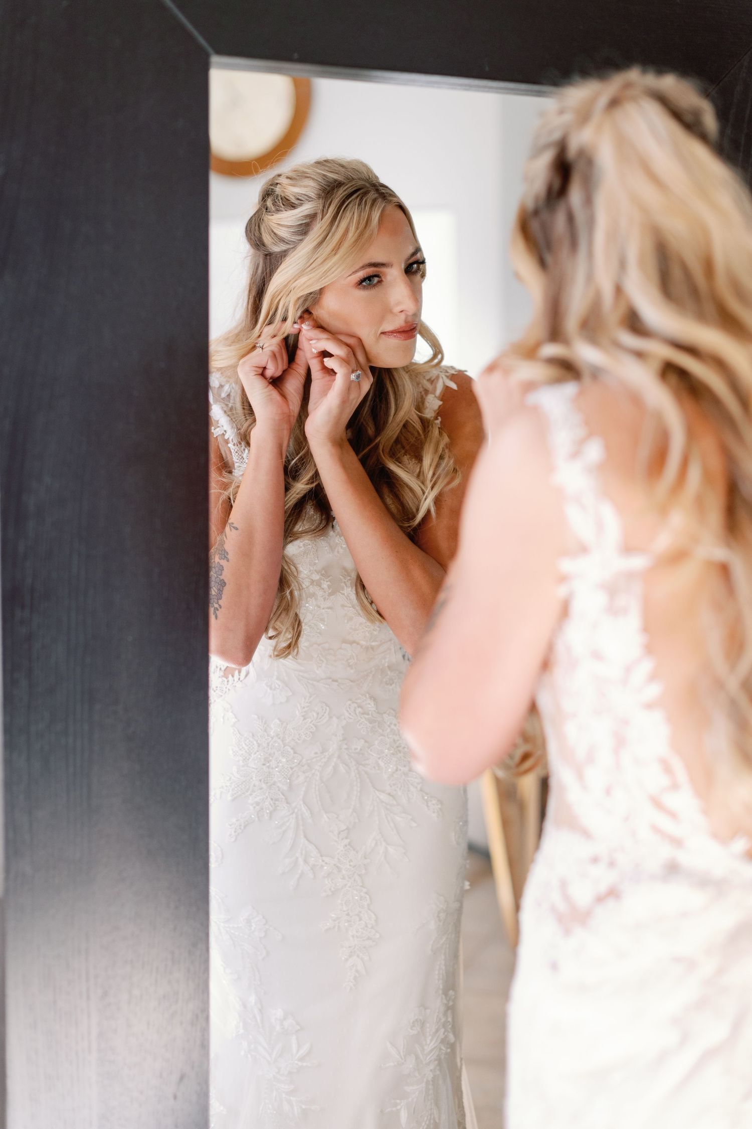 Getting ready shots with lace wedding dress details and mirror reflections.