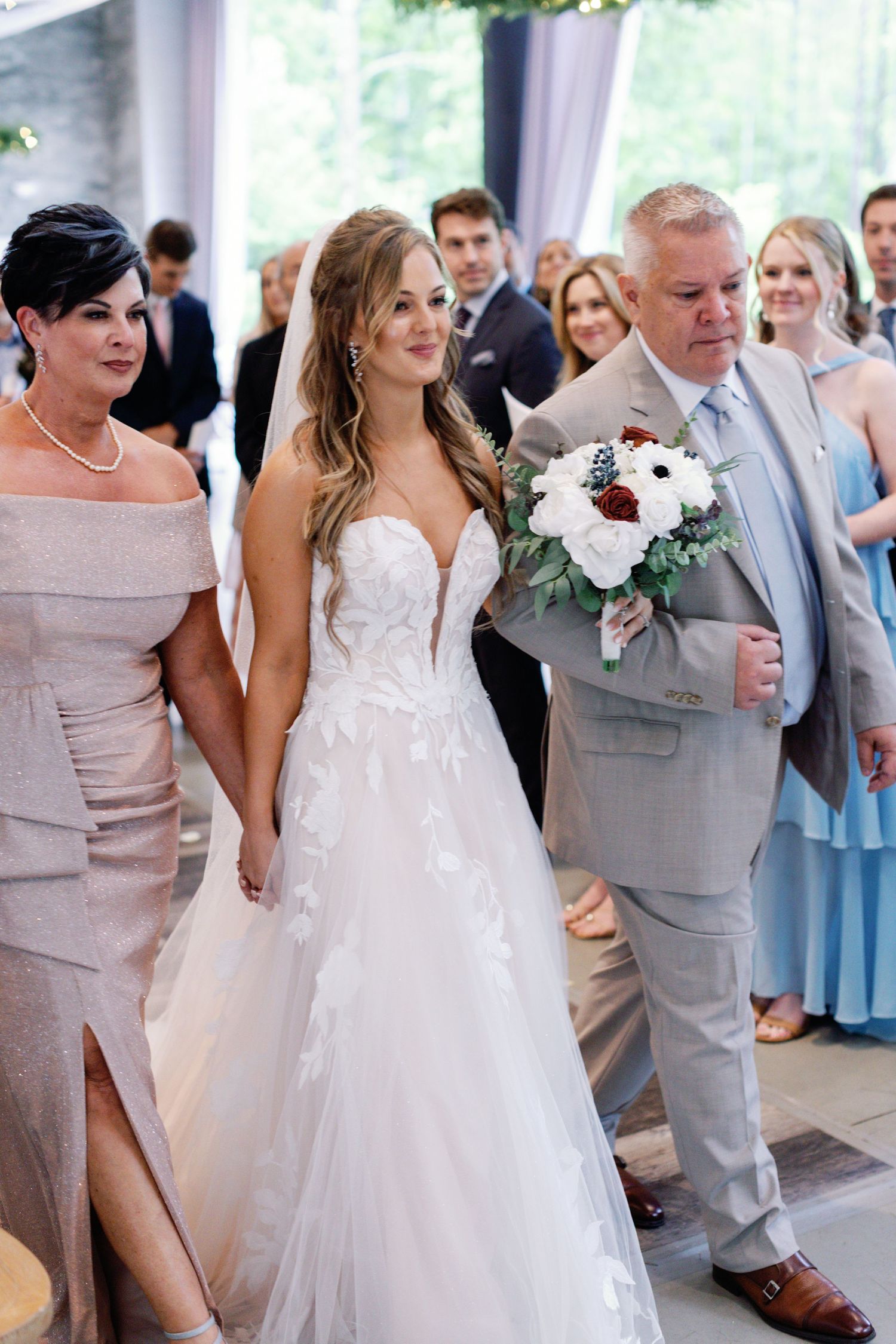 A wedding ceremony captured in a sequence showing the bride in a white gown and groom in a light gray suit walking together.