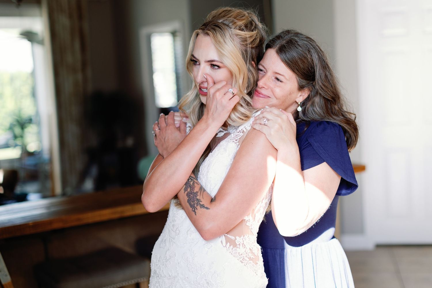 Wedding preparation moments with emotional reactions and embraces.