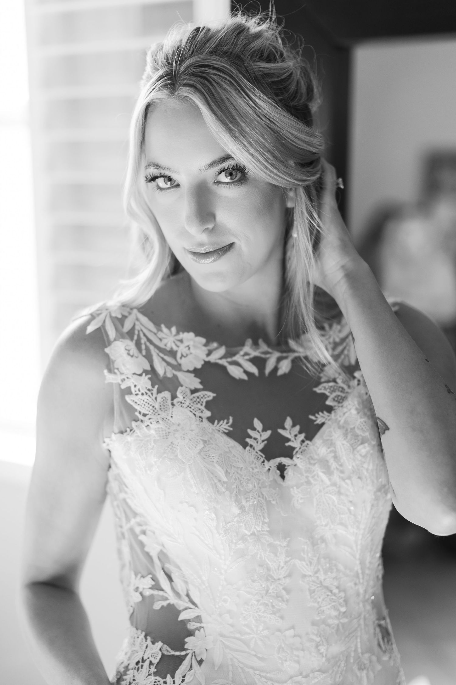 Wedding dress detail shots showing delicate lace and embroidery work.