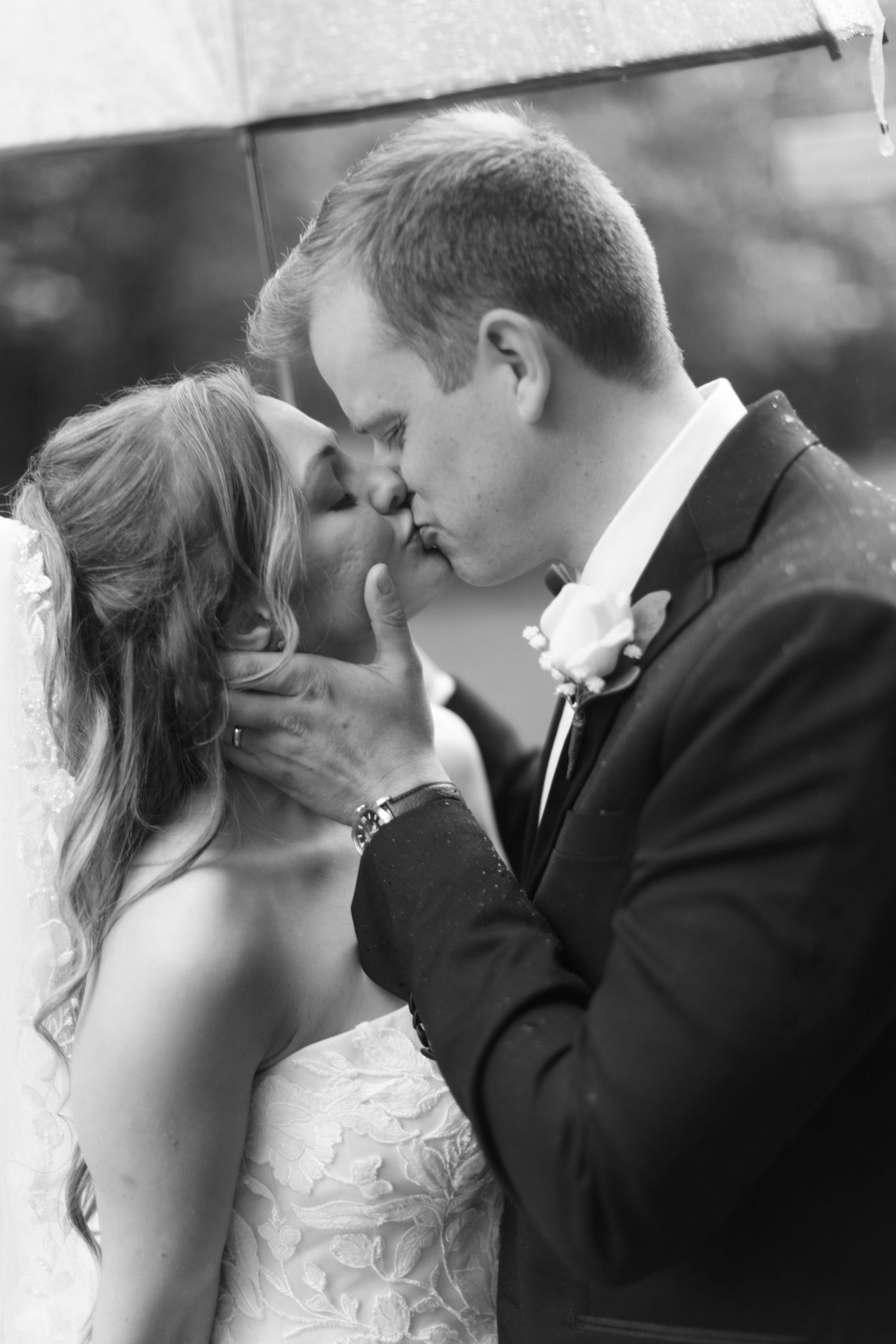 An intimate black and white wedding portrait showcasing tender moments.