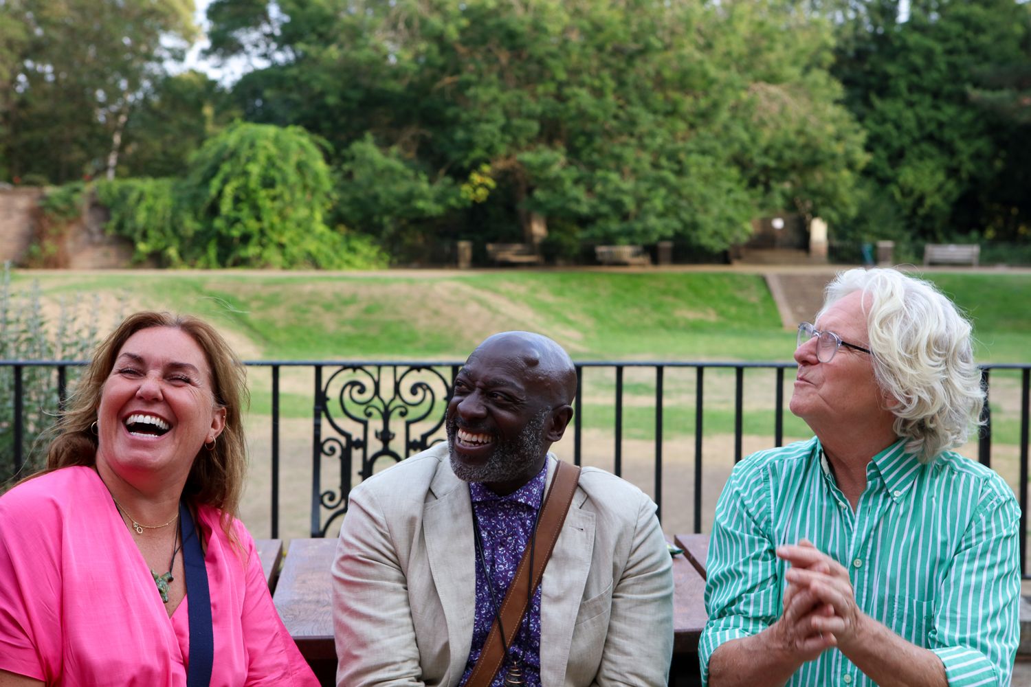 Event photography, candids. people hugging and laughing. Twickenham