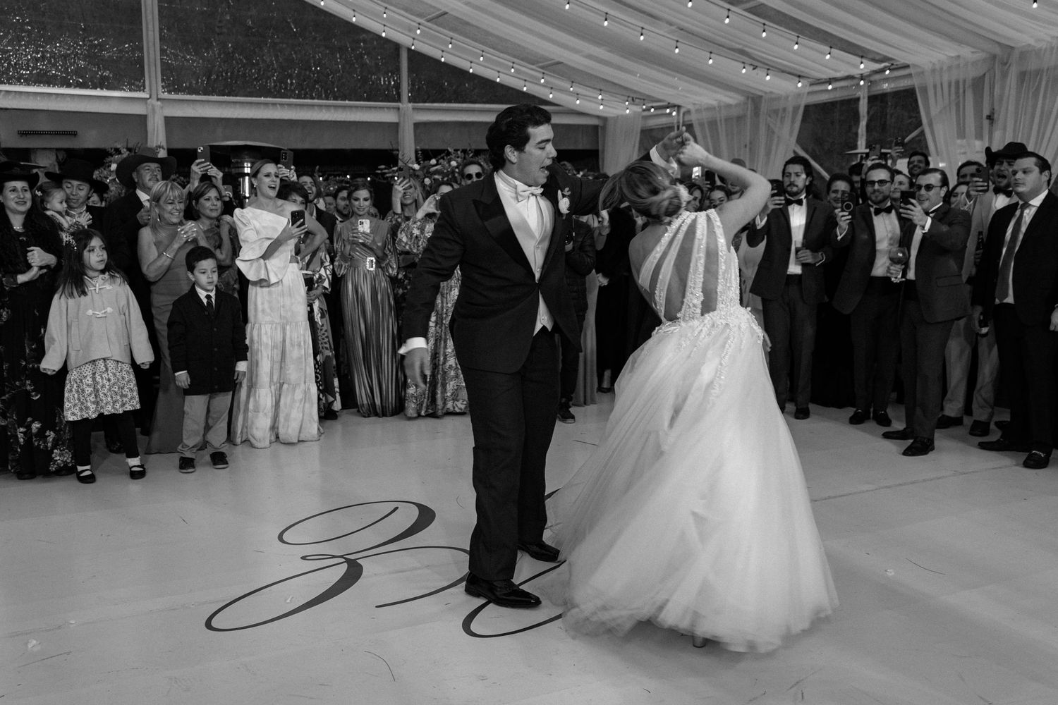 Laughter and movement captured during a joyful destination wedding party.