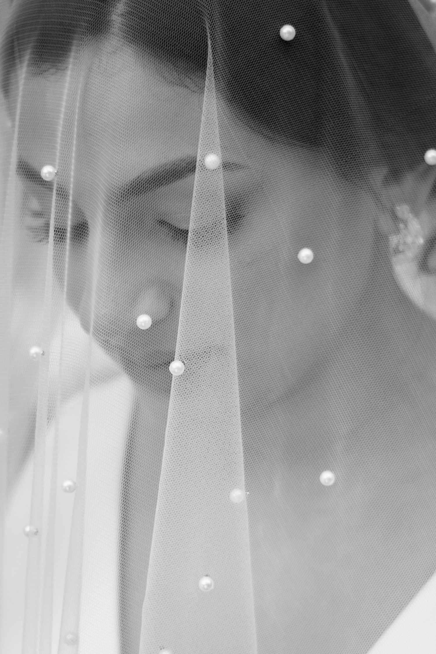 Bridal editorial portrait with soft tones and timeless elegance.