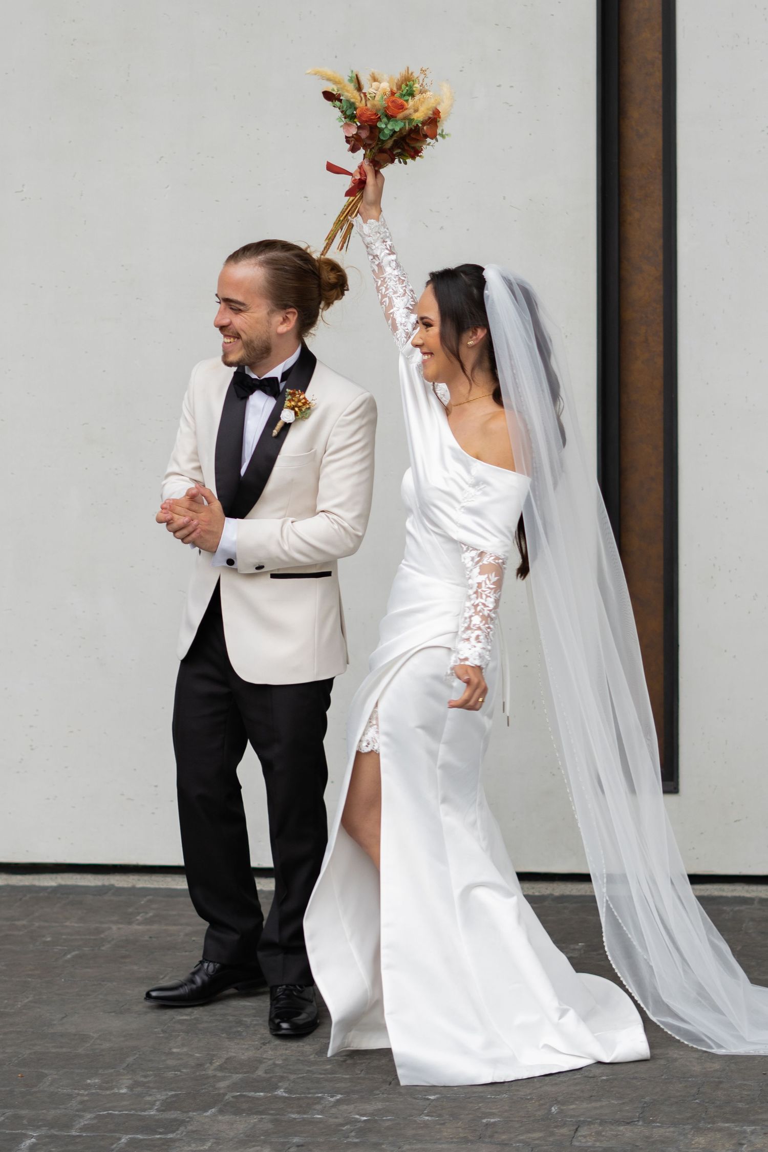 Romantic wedding couple captured in soft natural light with an elegant, refined look.