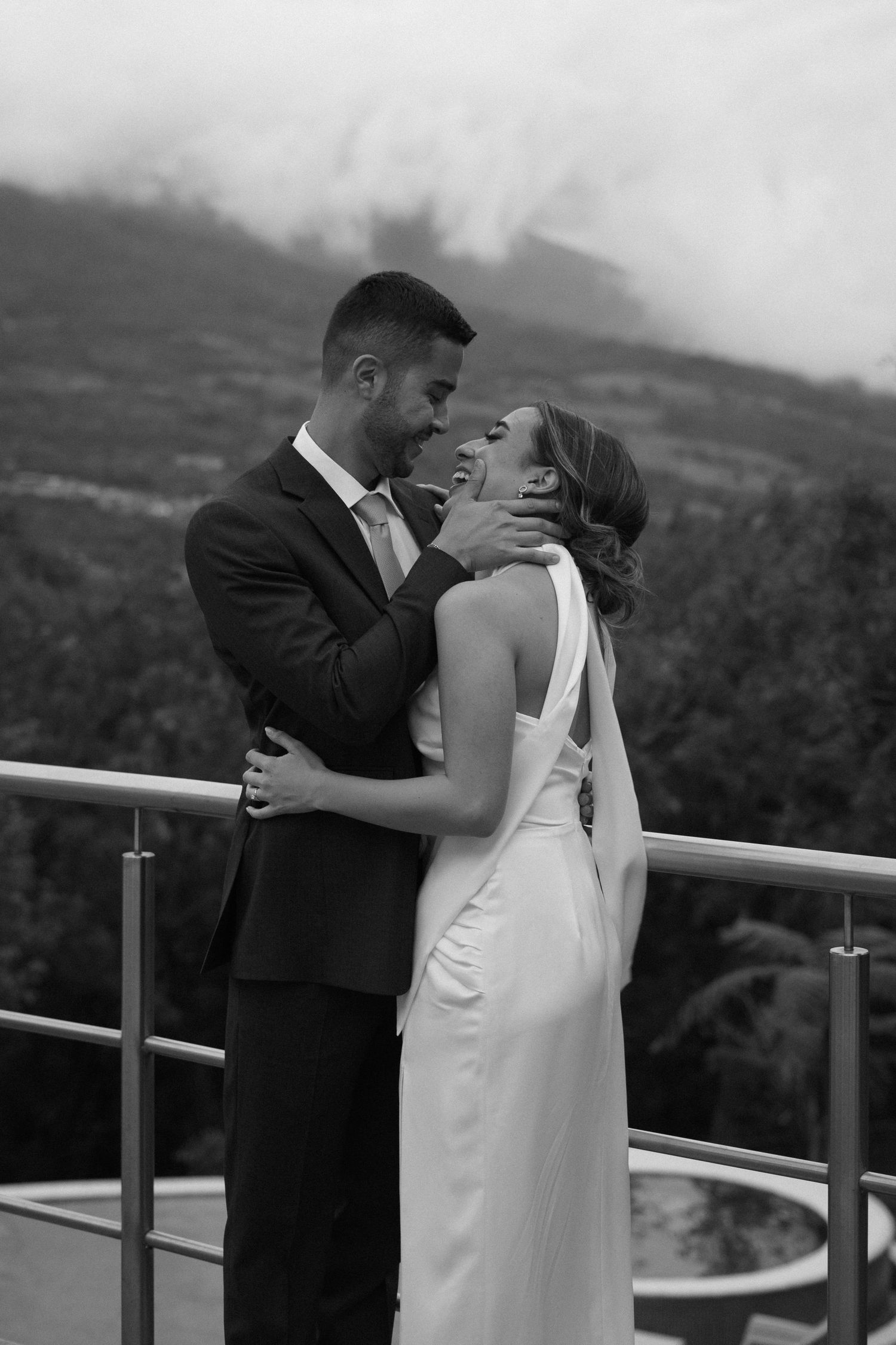 Romantic wedding couple captured in soft natural light with an elegant, refined look.