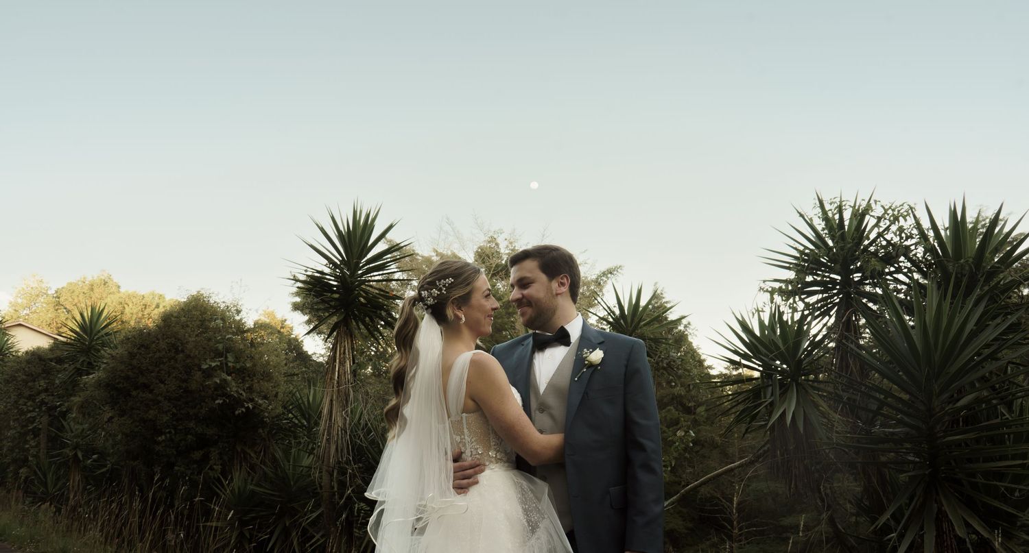 Intimate couple’s portrait surrounded by nature—perfect for outdoor wedding inspiration.