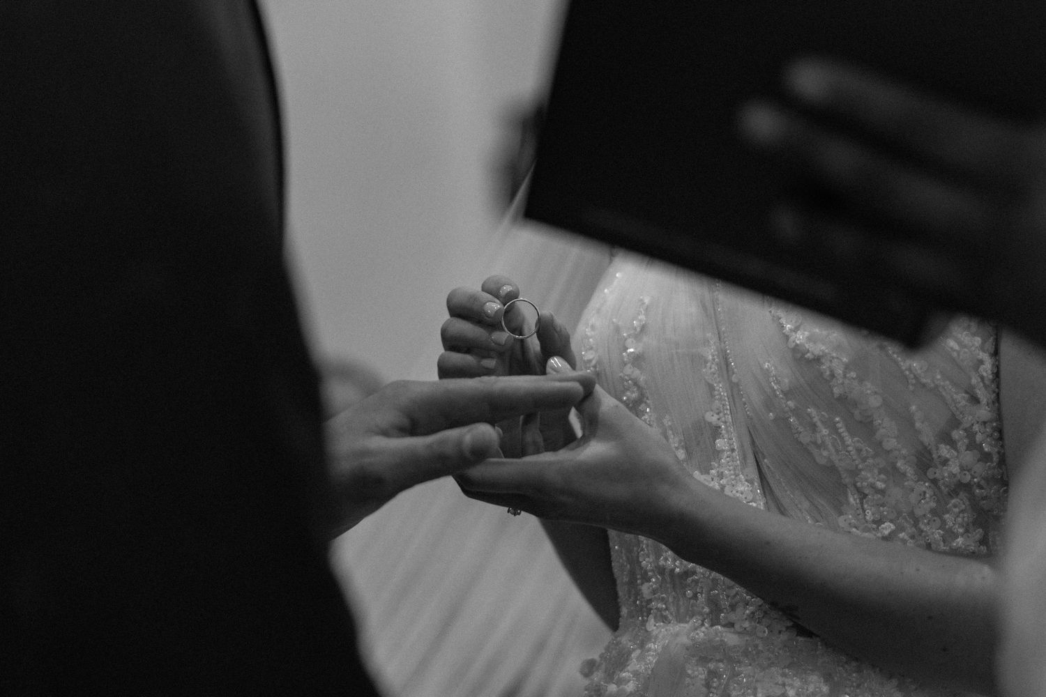 Candid exchange of vows during an intimate wedding celebration.