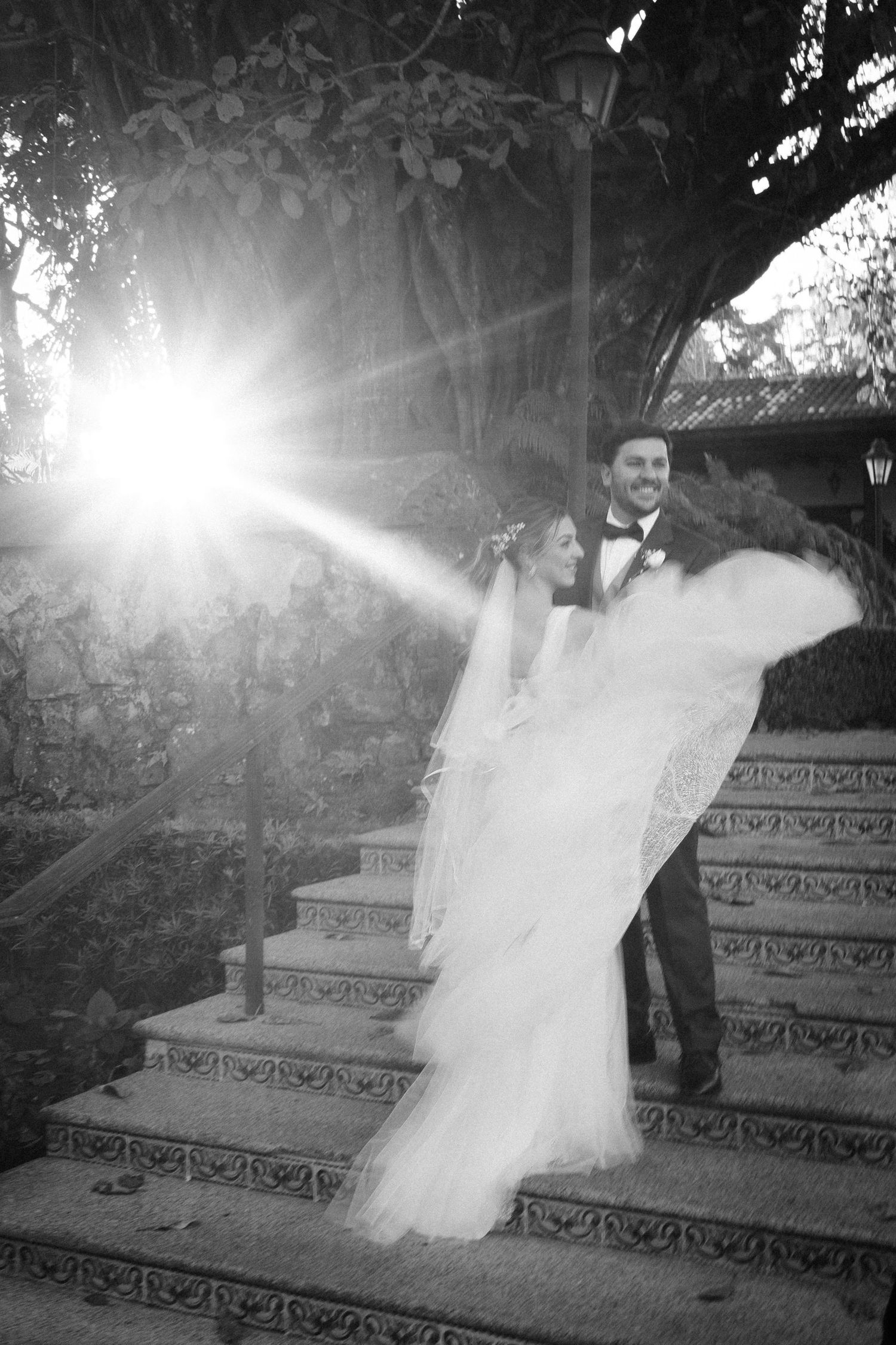 Romantic wedding couple captured in soft natural light with an elegant, refined look.