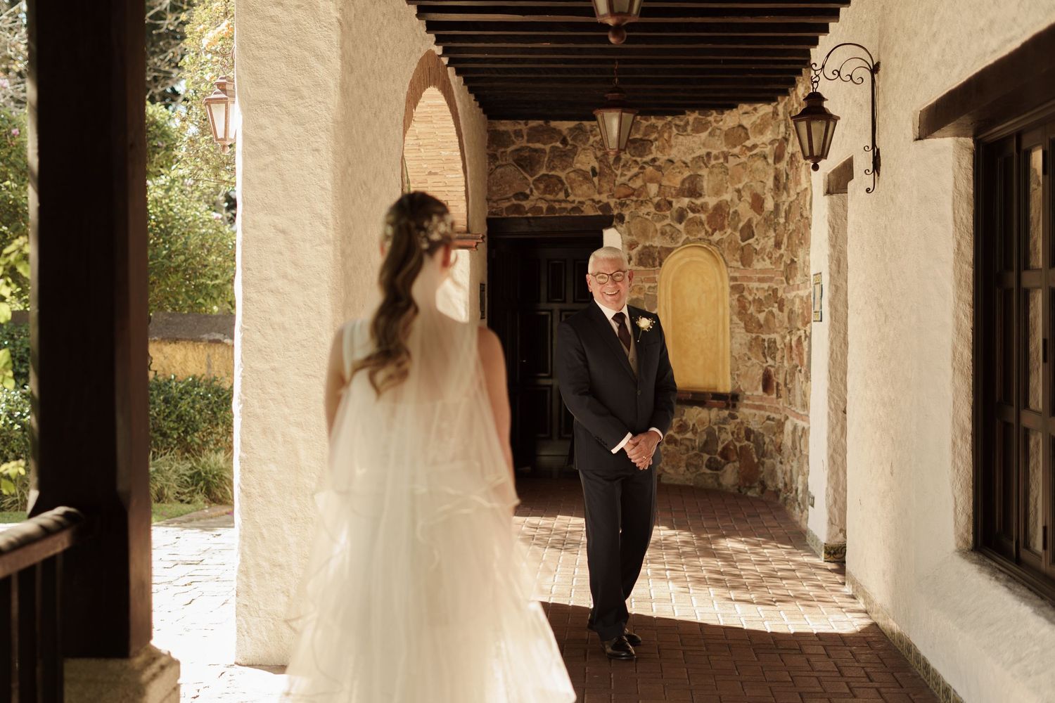 Romantic wedding couple captured in soft natural light with an elegant, refined look.