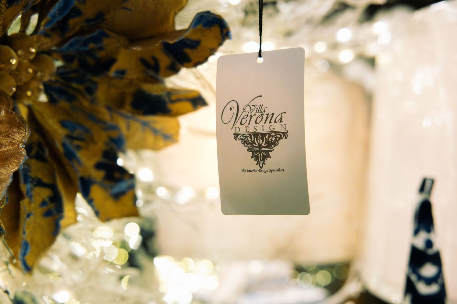 Close-up of white holiday candles and decorative items with soft lighting.
