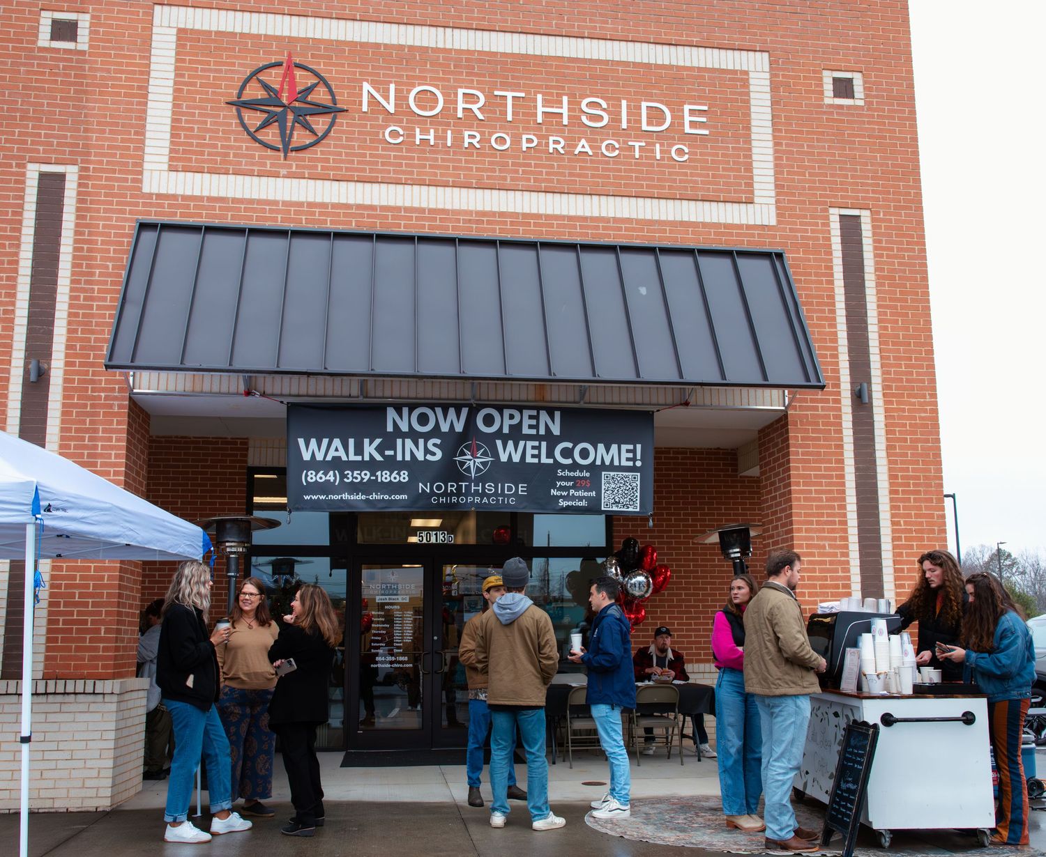 Exterior view of Northside Chiropractic office with brick facade and welcome signage.