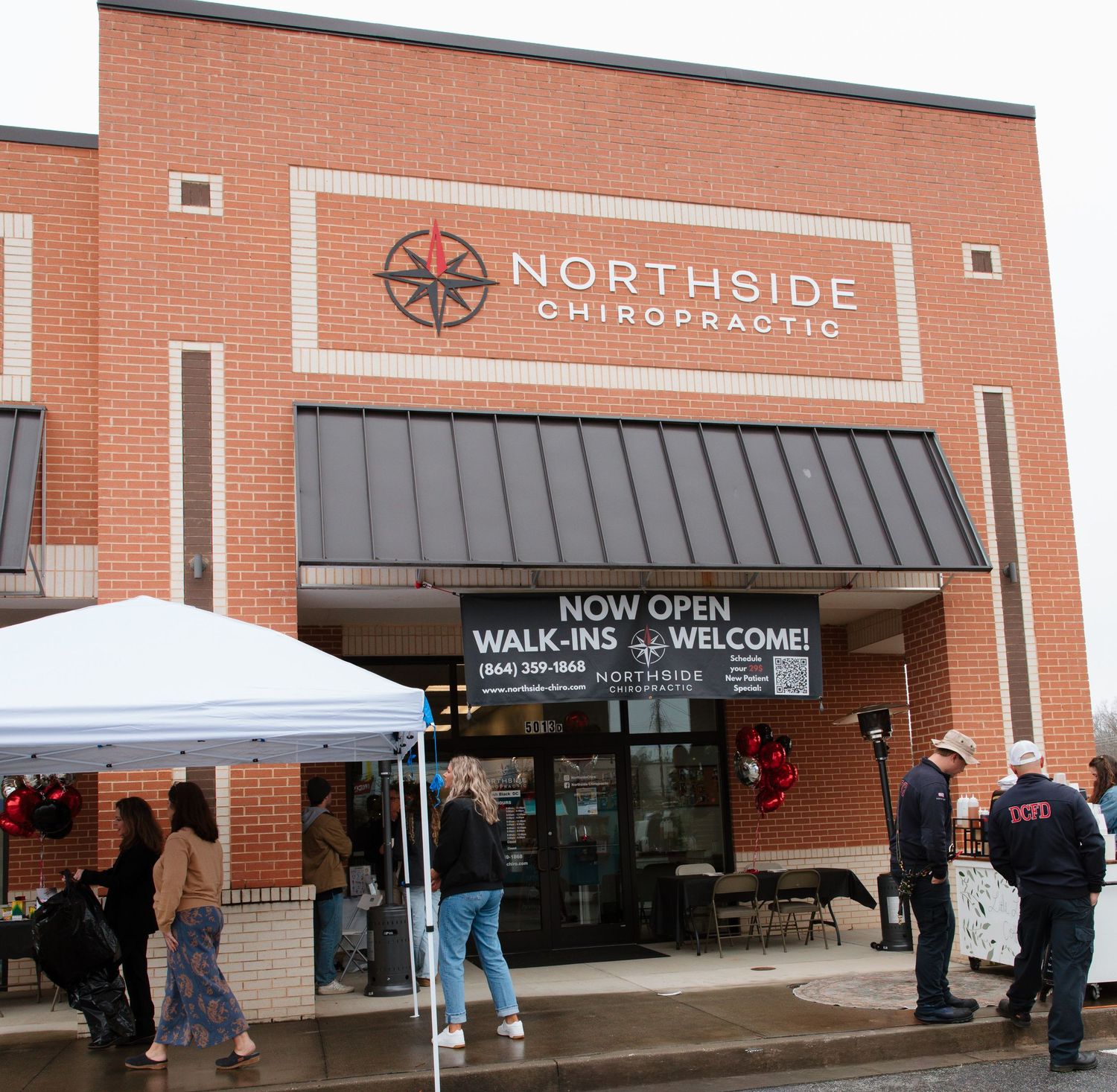 Exterior view of a brick commercial building with Northside signage and awnings.
