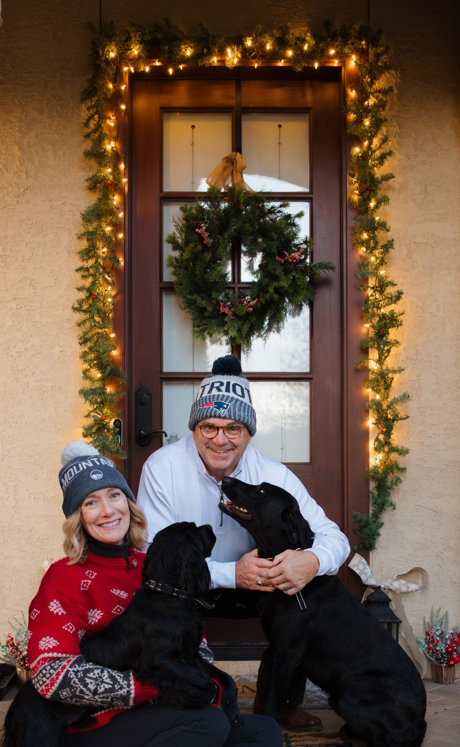 Joyful interaction on a festively decorated front porch.