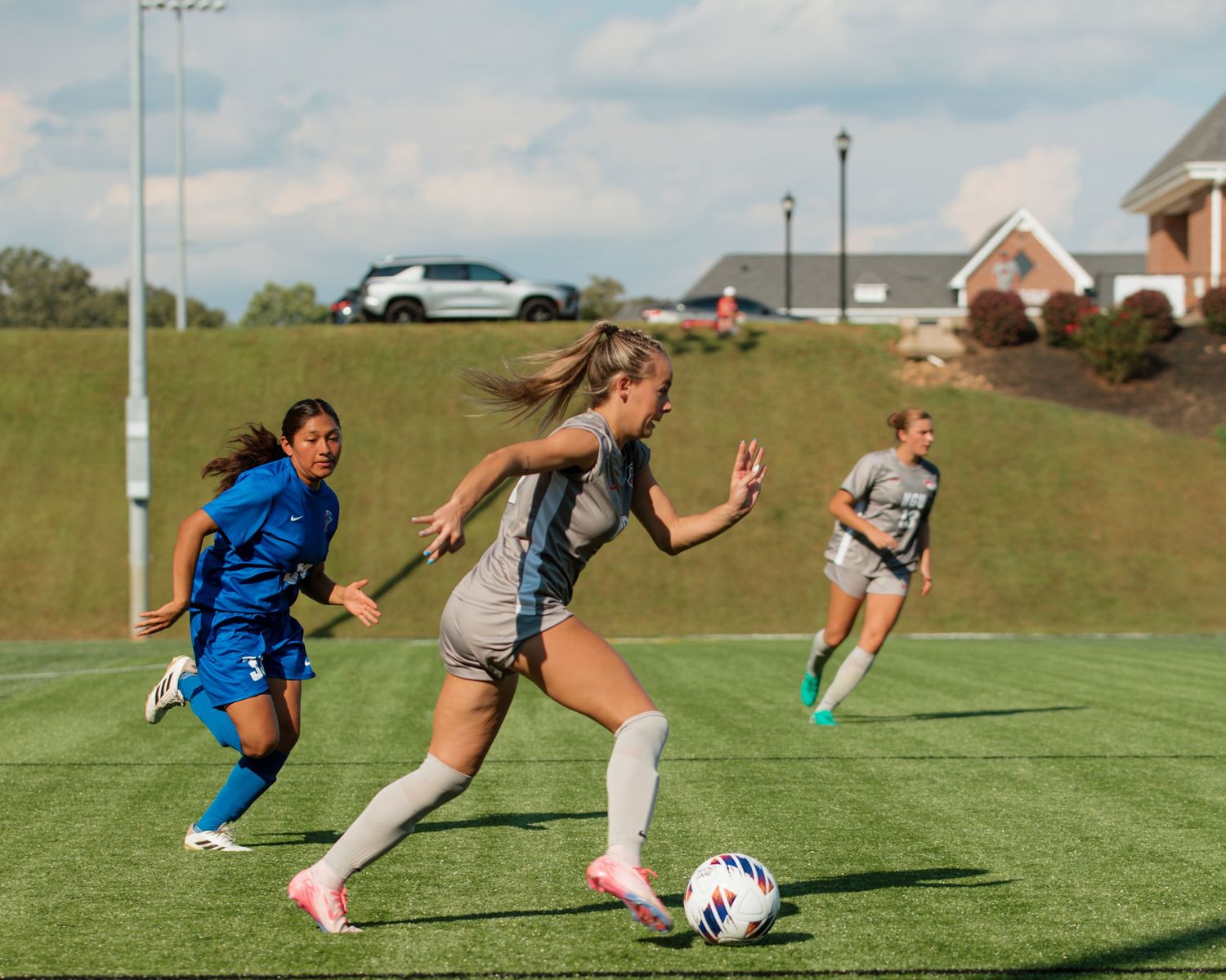 Athletes action shot, dribbling down the field
