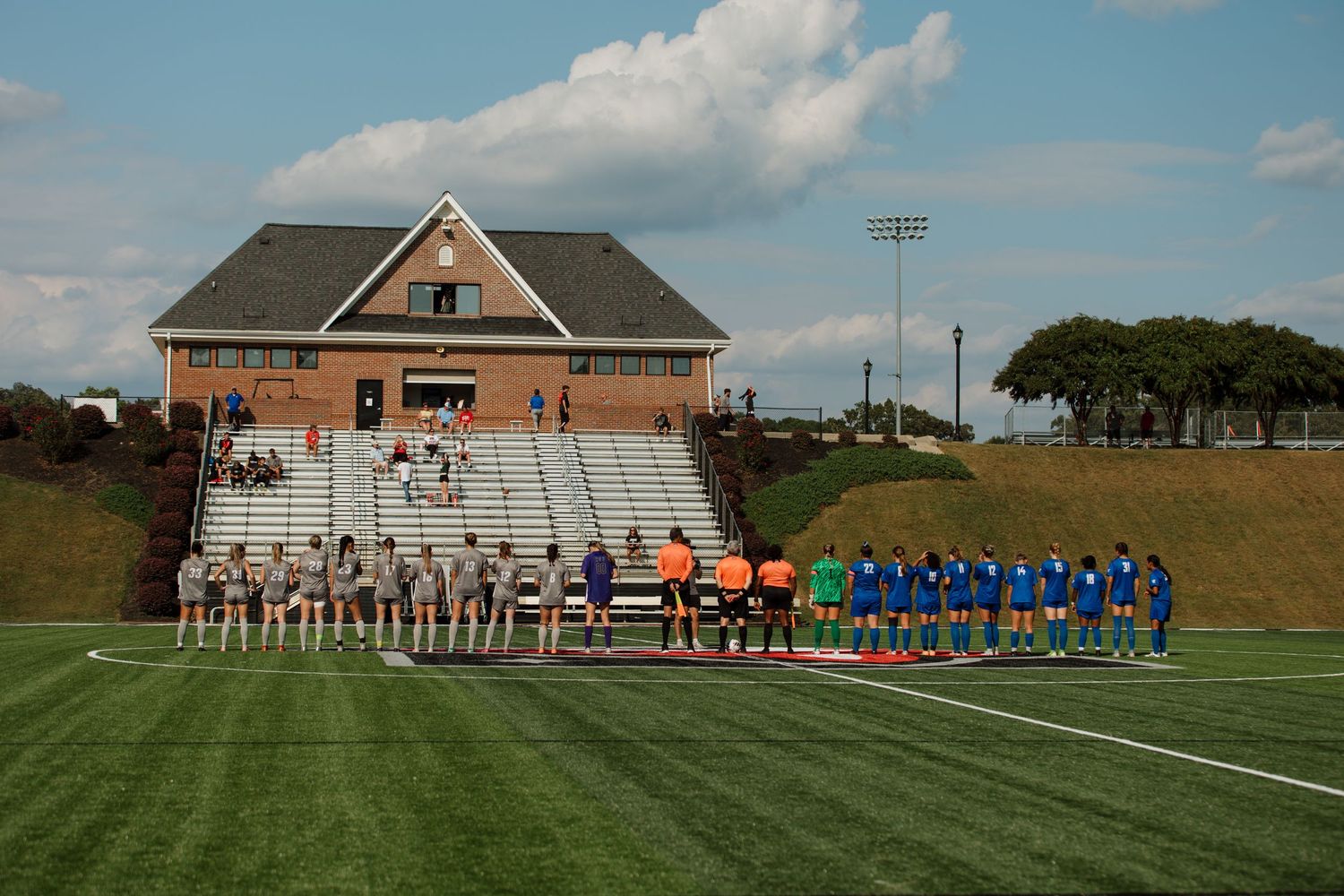 Starting line up walk out, both teams