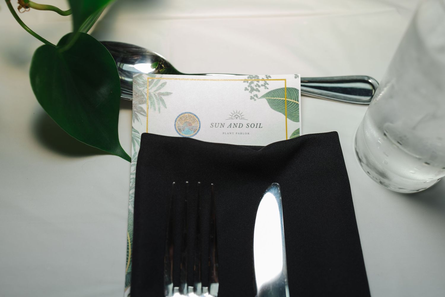 Close-up view of elegant plated appetizers being carefully prepared in a restaurant kitchen.