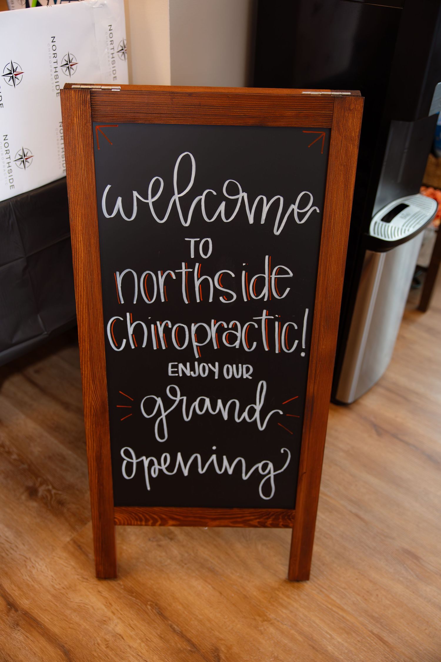 Wooden framed chalkboard signs with handwritten welcome messages for Northside grand opening.