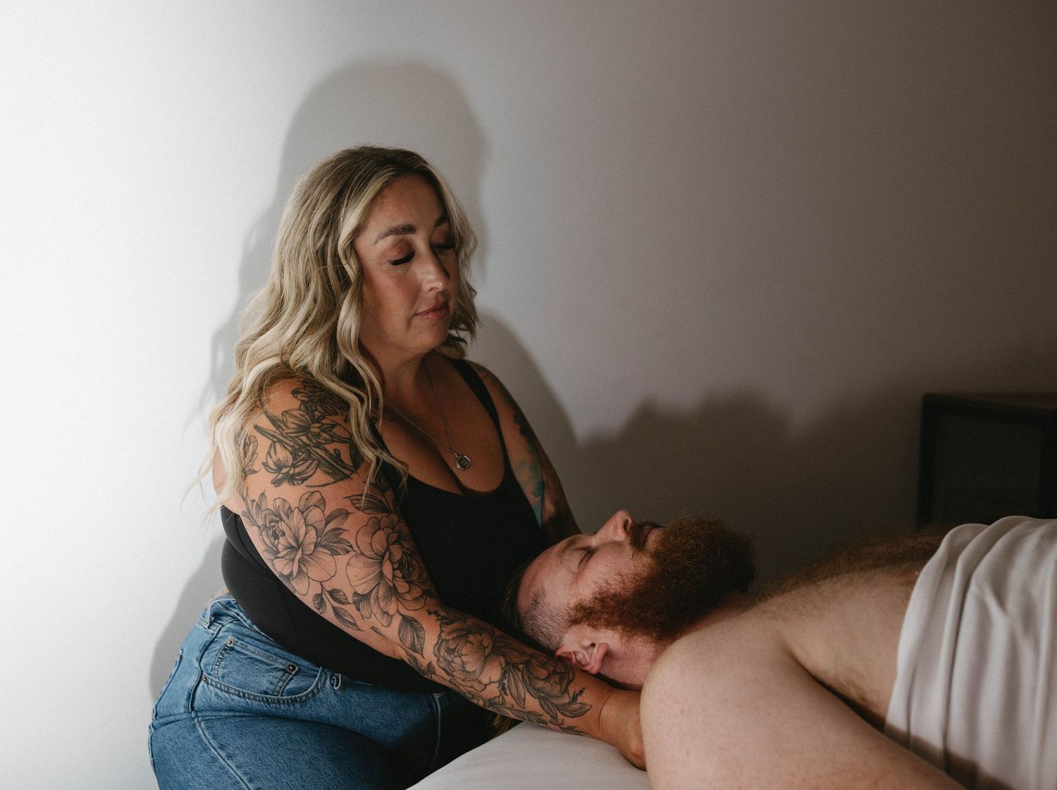 Therapeutic massage being performed in a calm, peaceful spa environment.