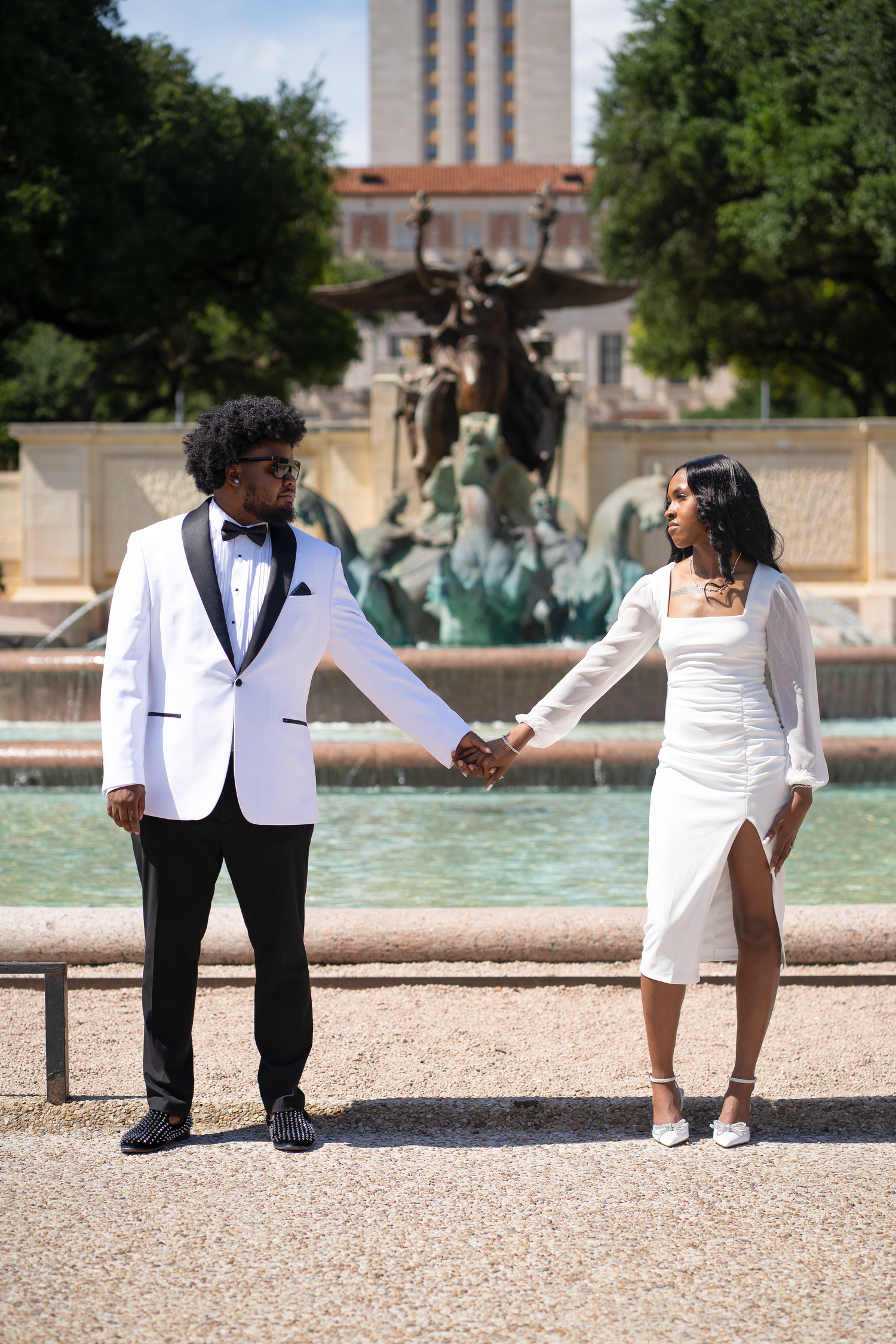 Newly weds posing to celebrate their marriage in downtown Austin, Tx.