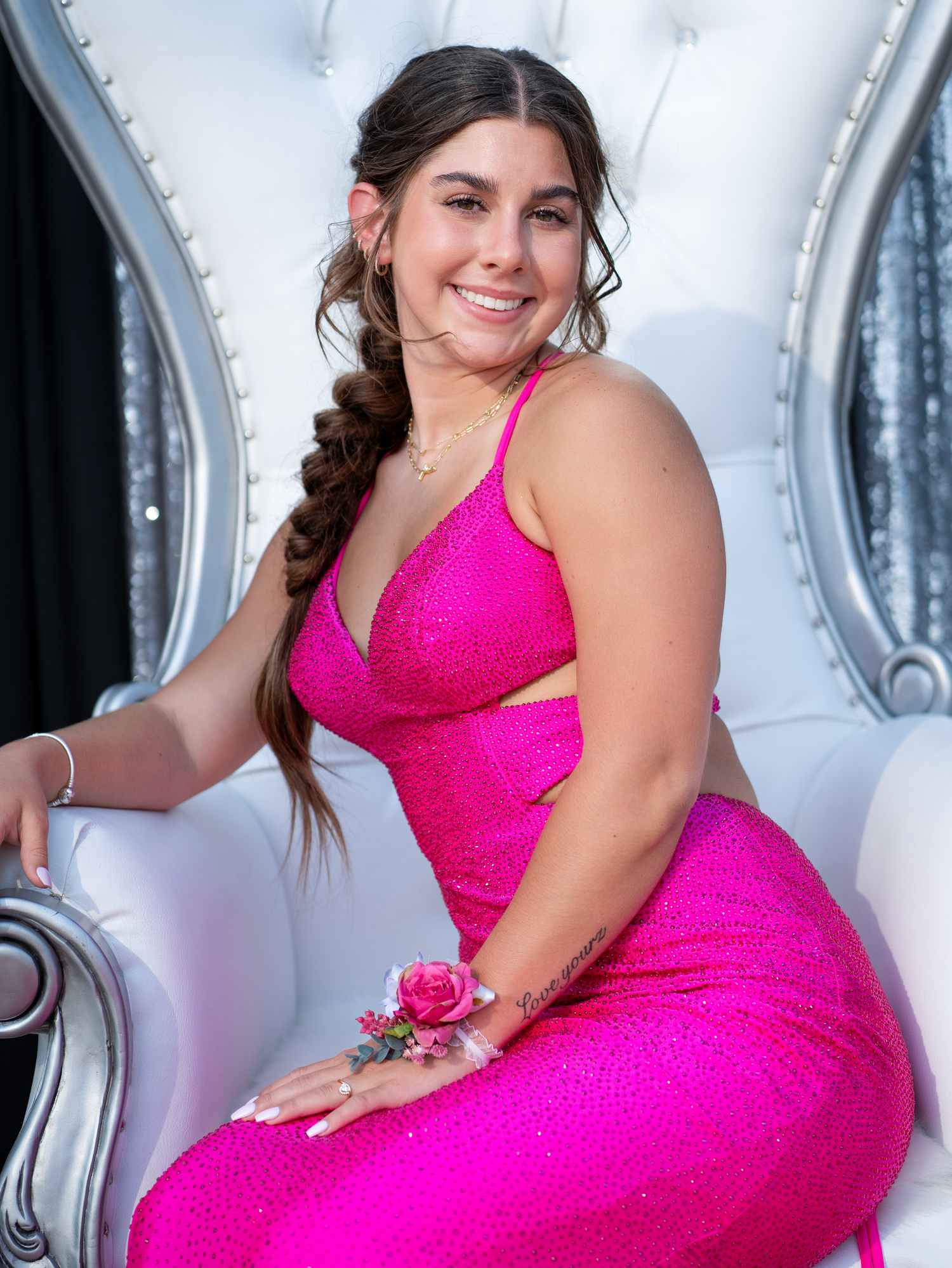 Individual prom photo posed on a queen chair in North Austin.