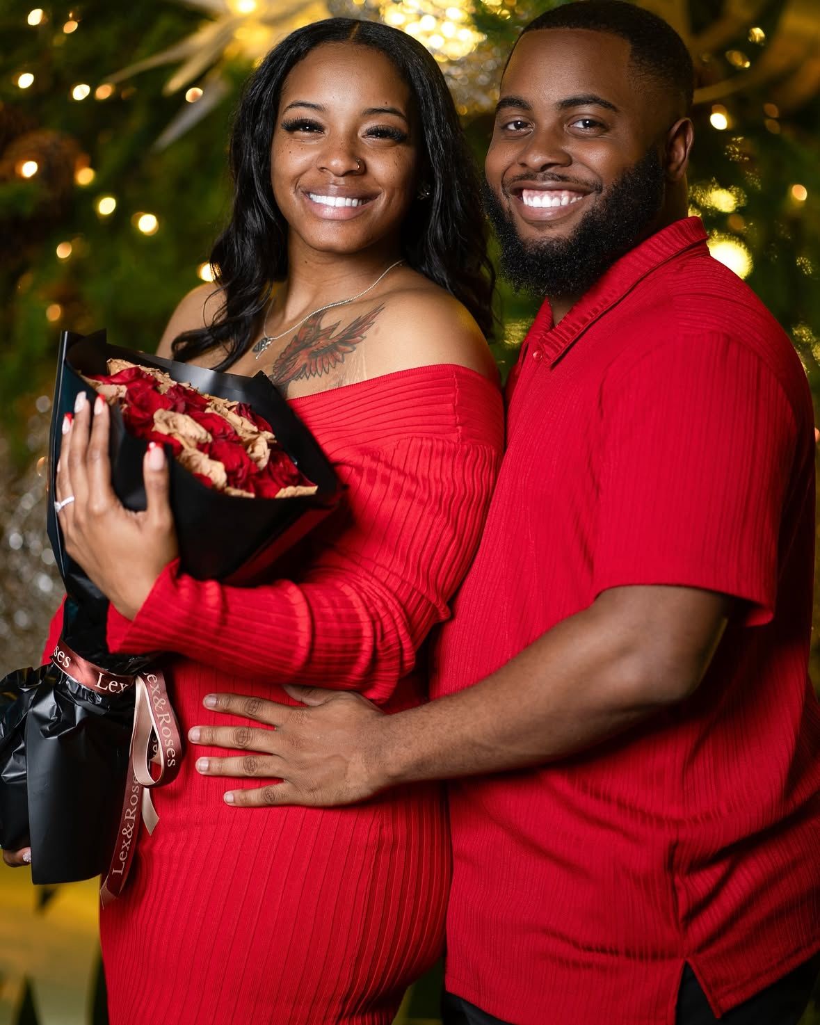 Newly engaged couple posing to show off their huge announcement in Austin, TX.