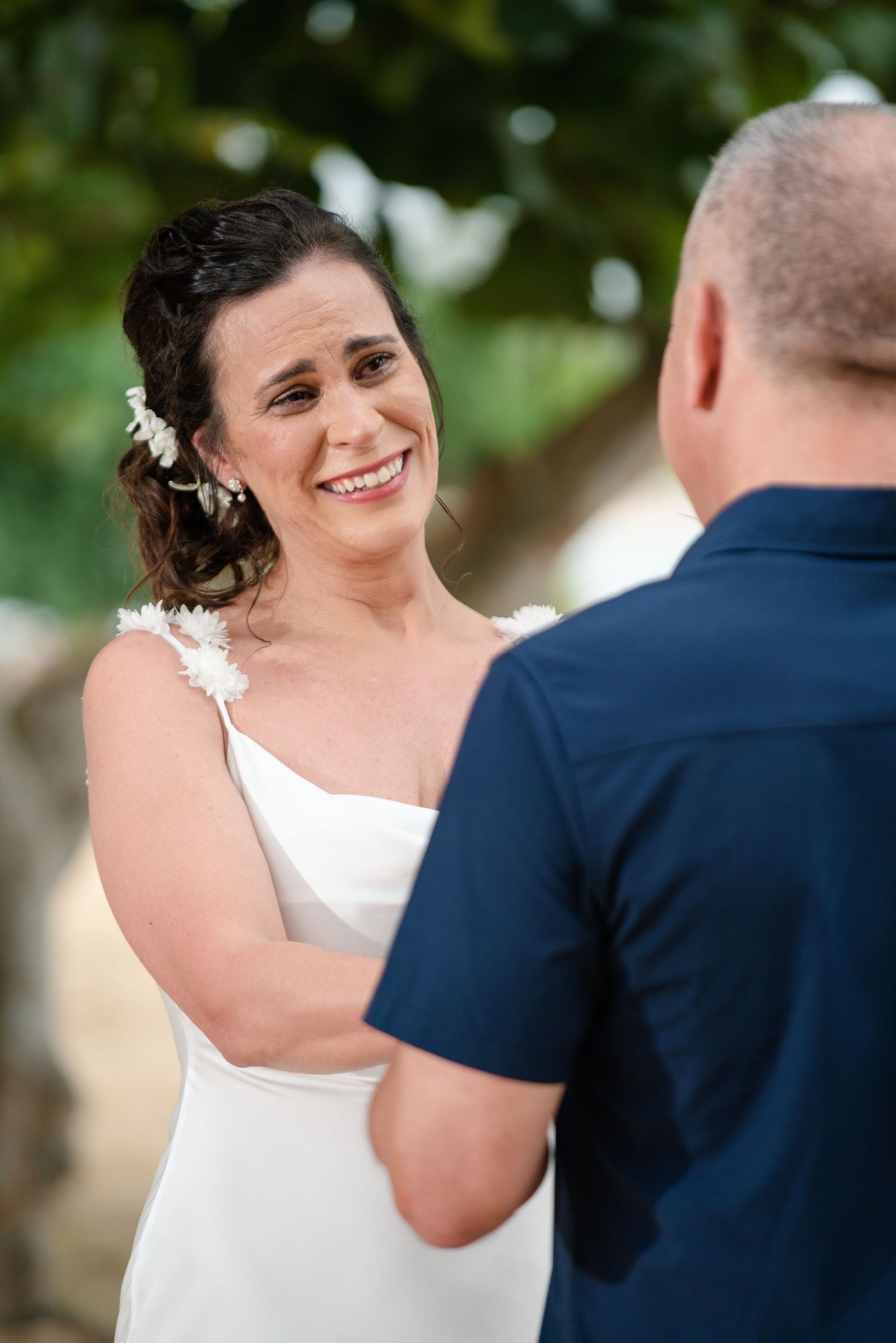 Series of romantic wedding photos showing tender moments between bride and groom during outdoor ceremony.