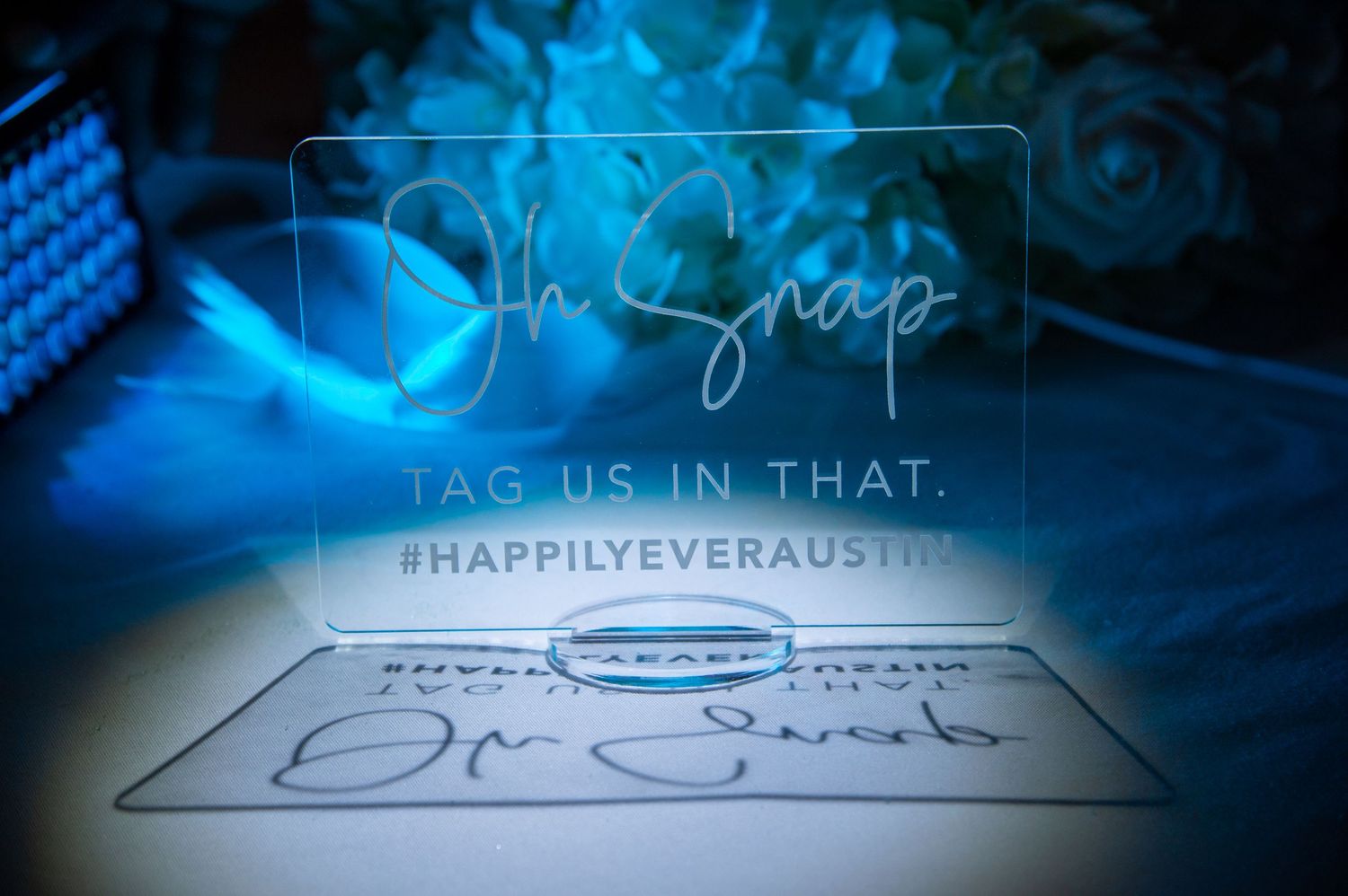 A series of shimmering blue lighted graphics and text overlays appear in an abstract digital banner design.