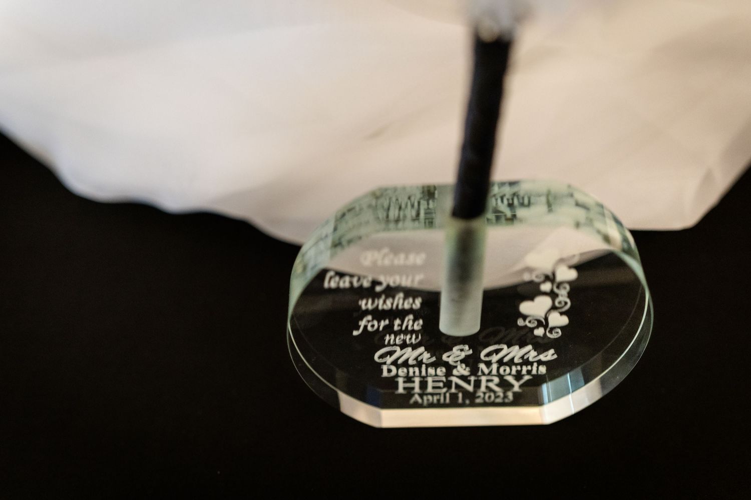 A sequence of glass trophies with engraved text engraved on their bases display customized messages for recognition.