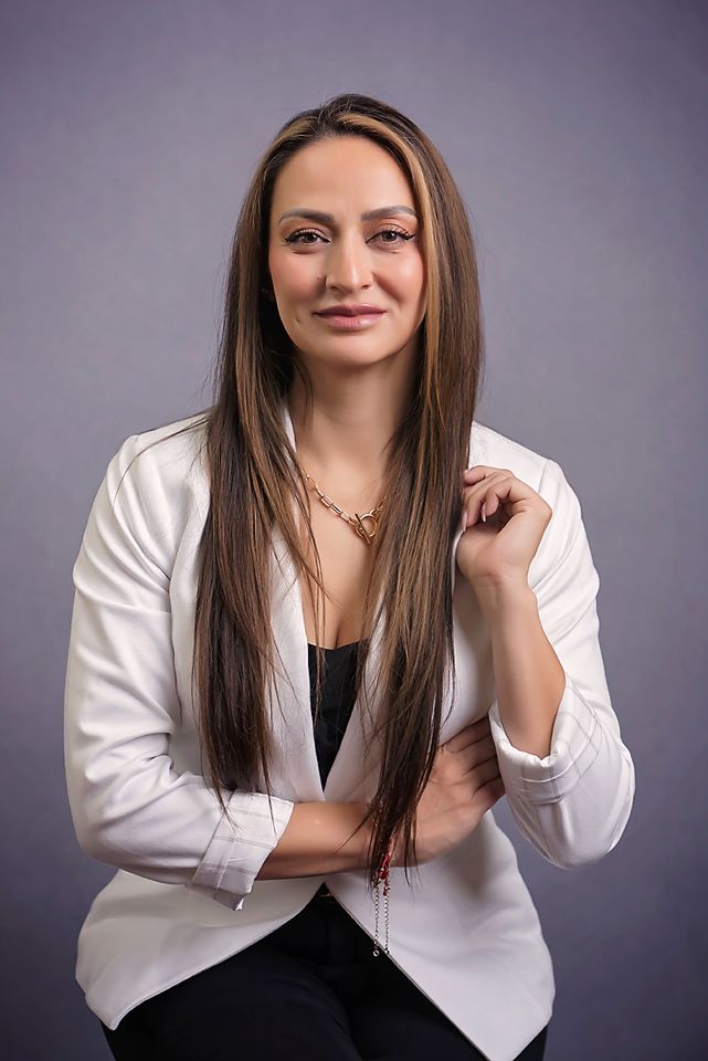 san diego Professional headshots showing a woman in a white blazer posing against a gray studio backdrop.