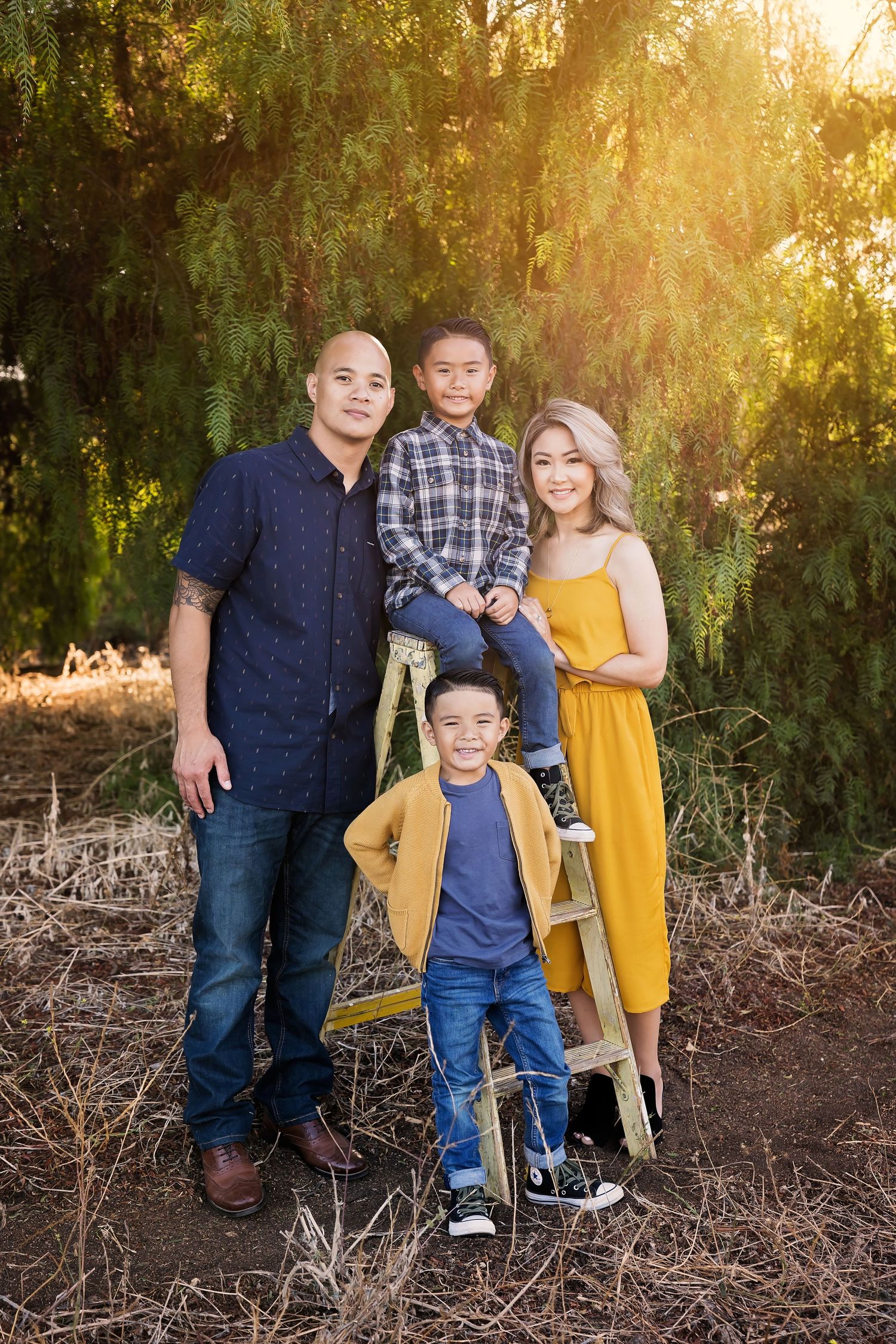 Family group portrait at sunset with eucalyptus trees and coordinating outfits — Chula Vista session