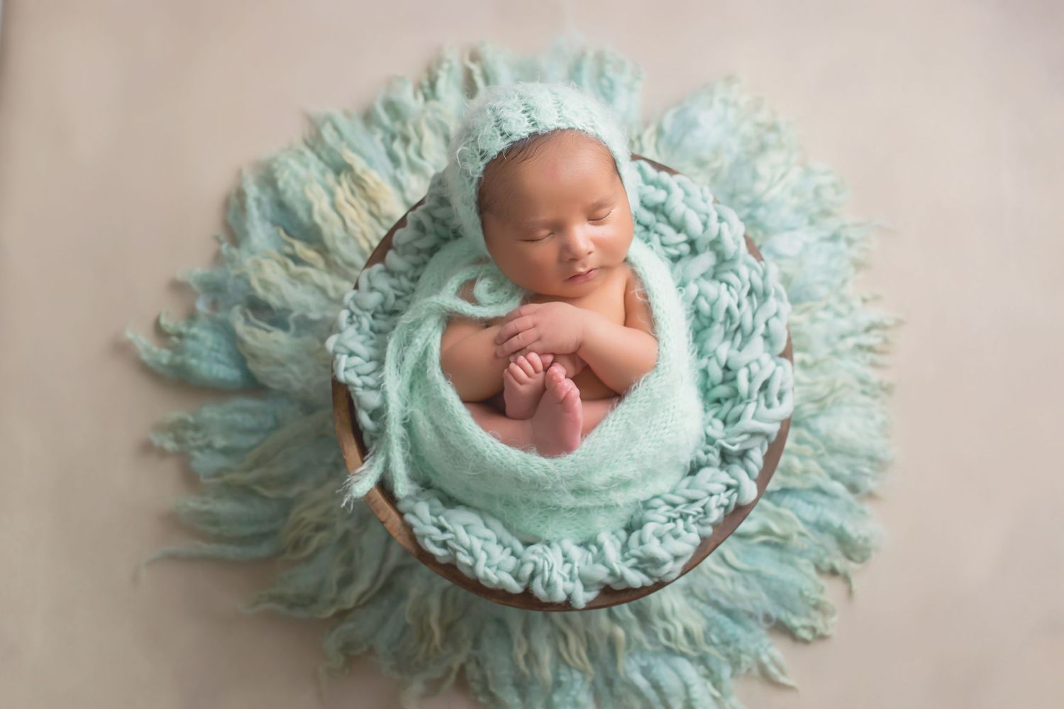 Newborn photography series featuring mint green textured blanket backdrop. San Diego Newborn Photographer