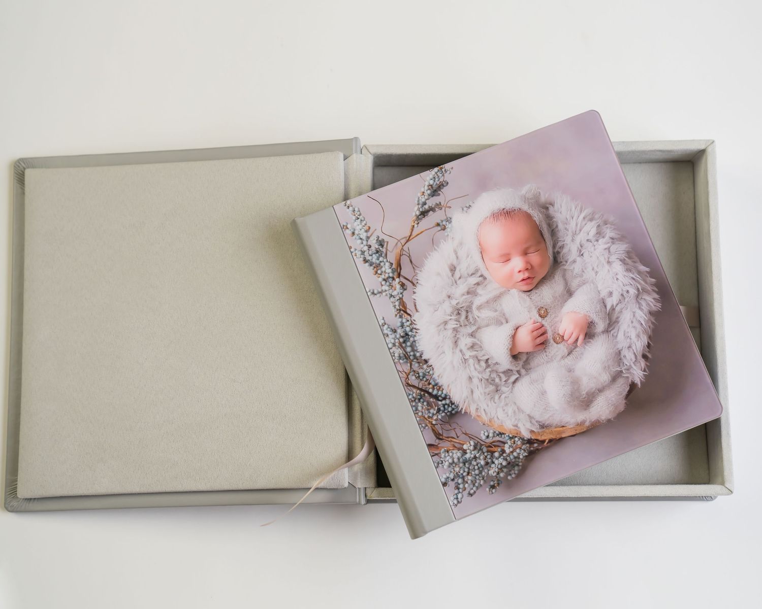 Newborn Photography album and matching box with photos  displayed in an elegant layout.
