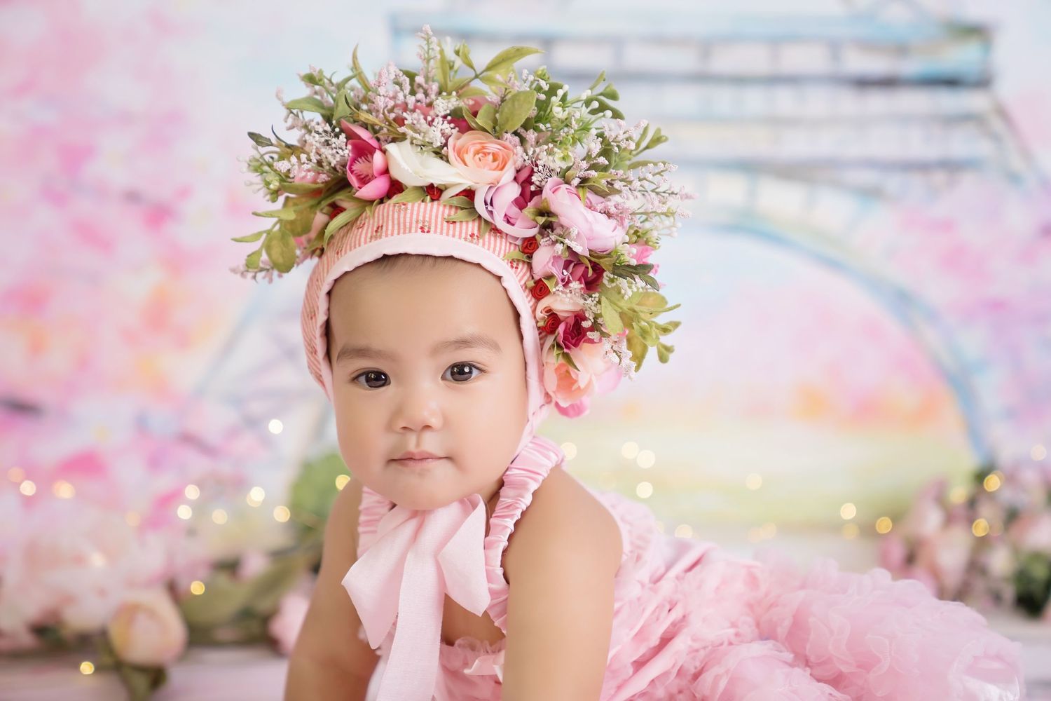 San Diego cake smash with paris theme and Delicate pink floral photography setup with vintage elements and soft lighting.