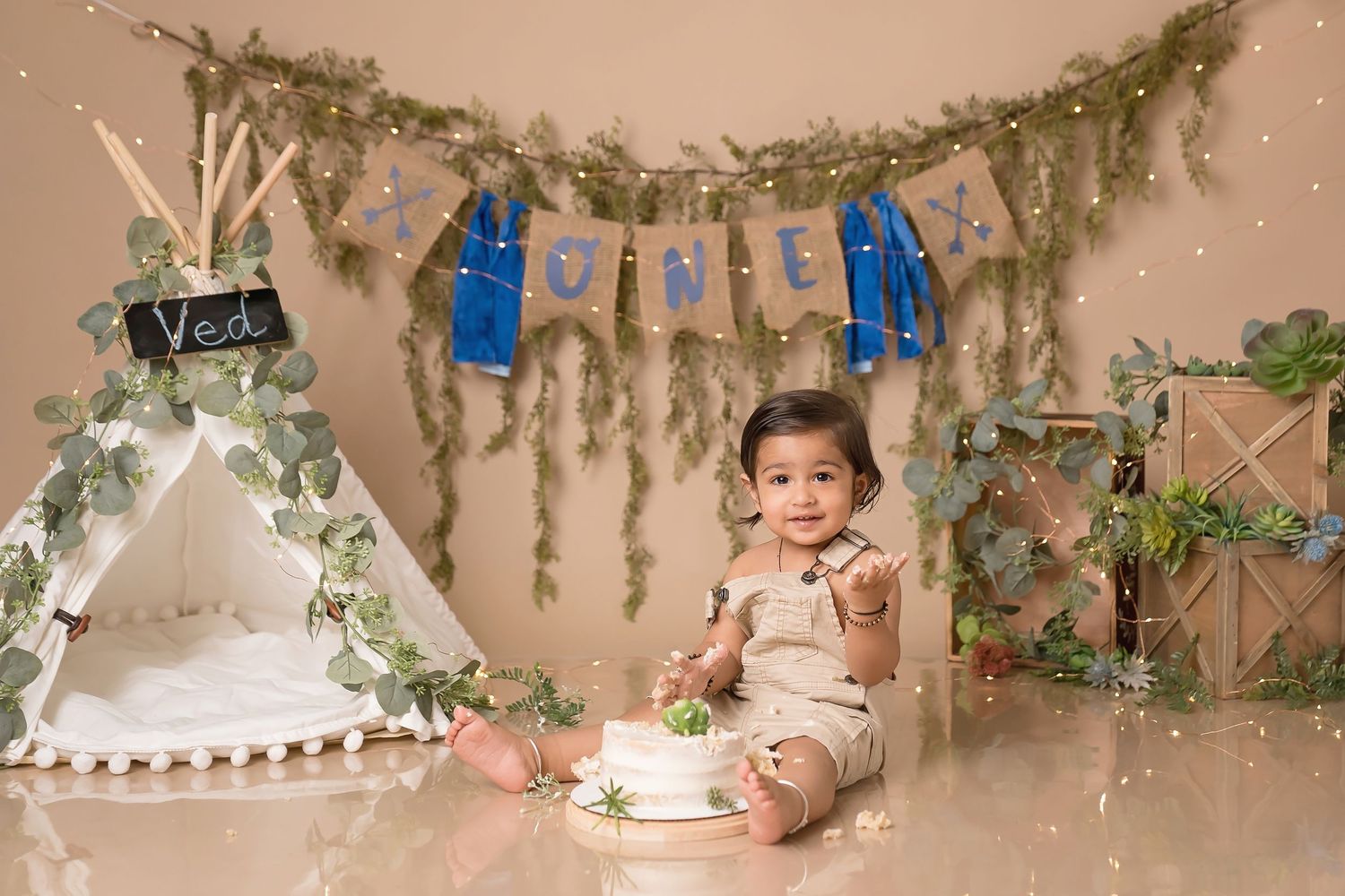 Enchanting garden-themed photography set with hanging vines and soft lighting.