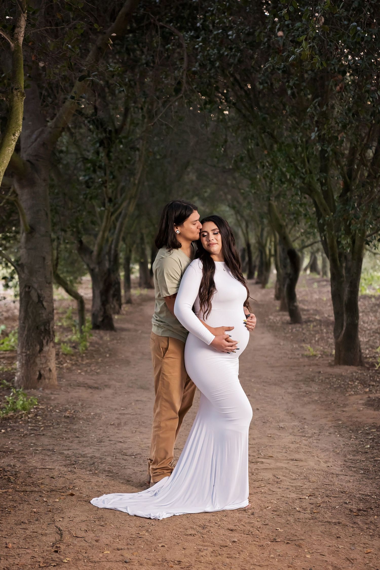 Intimate maternity session captured in a serene wooded setting. San Diego Maternity Photographer