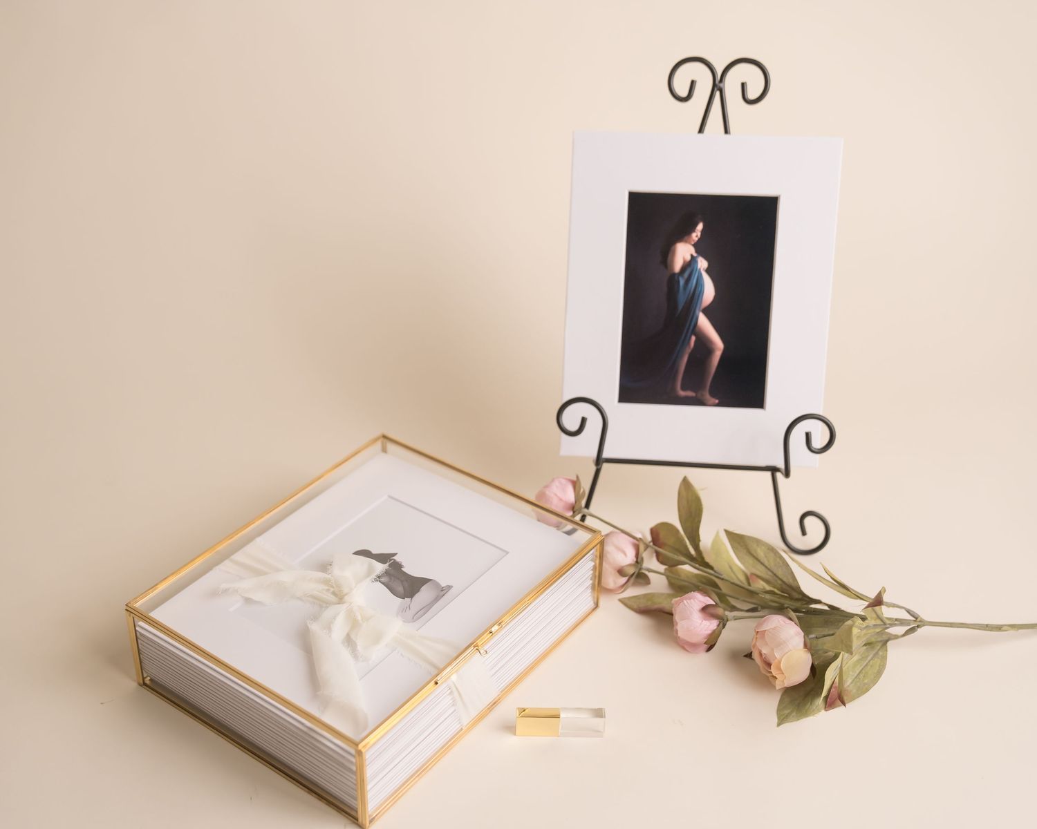 Multiple photos showcasing an elegant white art book lying on beige surface with delicate floral decorations. San Diego Maternity Session