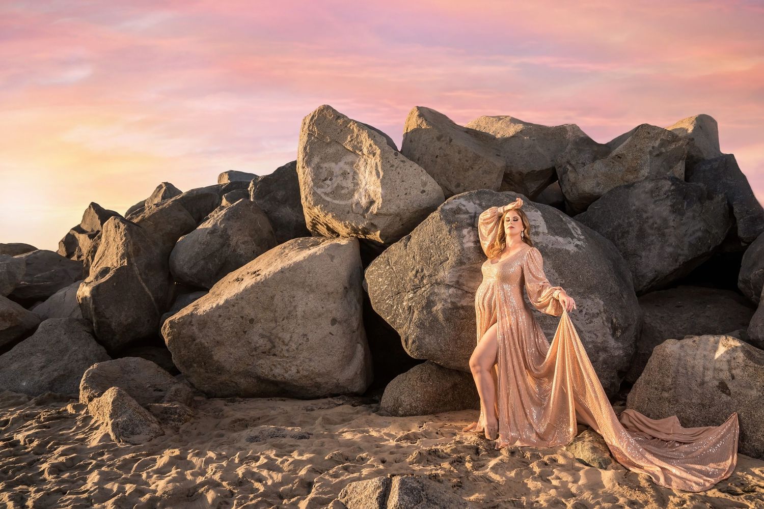 Artistic maternity portraits captured among rocky coastal formations during sunset. San Diego Maternity Photographer