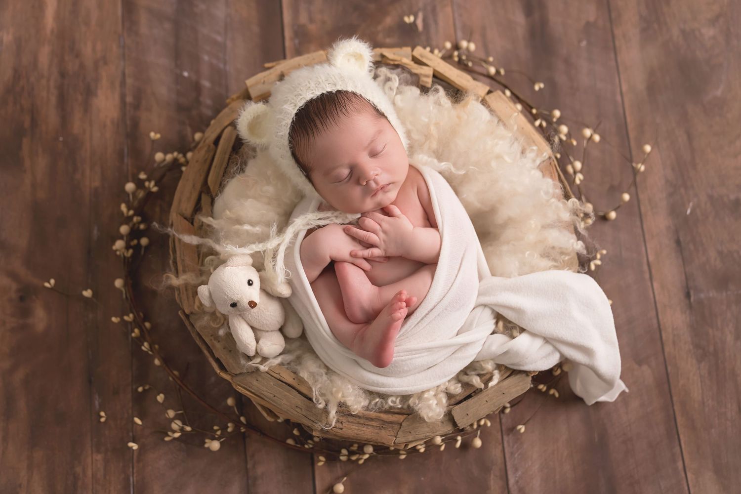 San Diego newborn photographer captures newborn baby photos with soft brown and neutral tones wooden bowl.