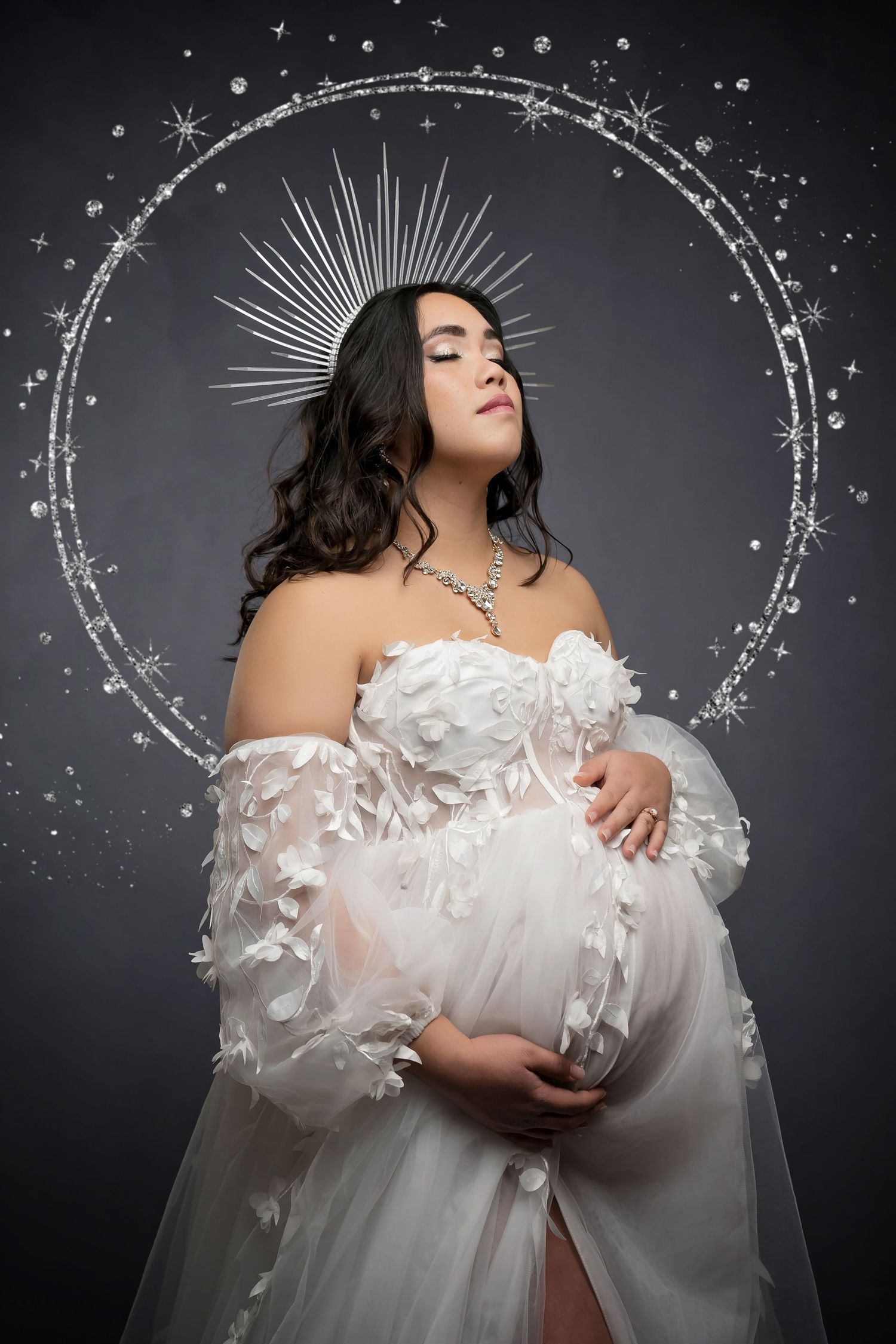 Maternity Ethereal images show flowing white dress with sparkly star-like elements creating magical atmosphere in san diego photo studio