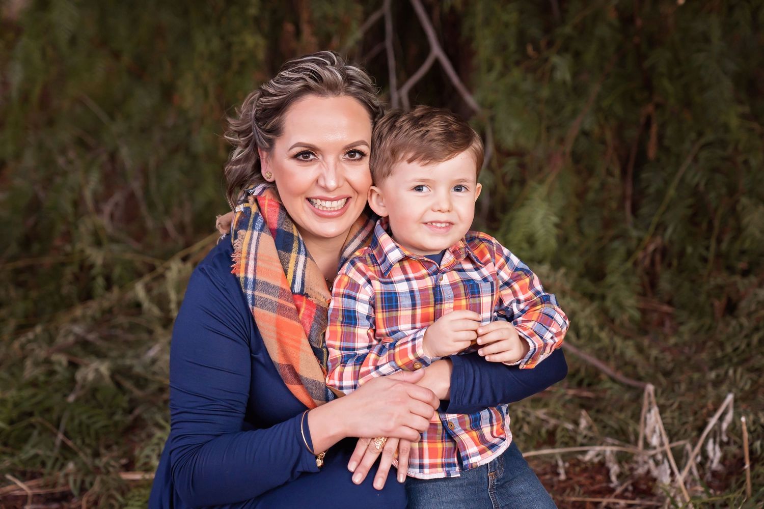 Family portrait outdoors with warm autumn colors and soft natural lighting