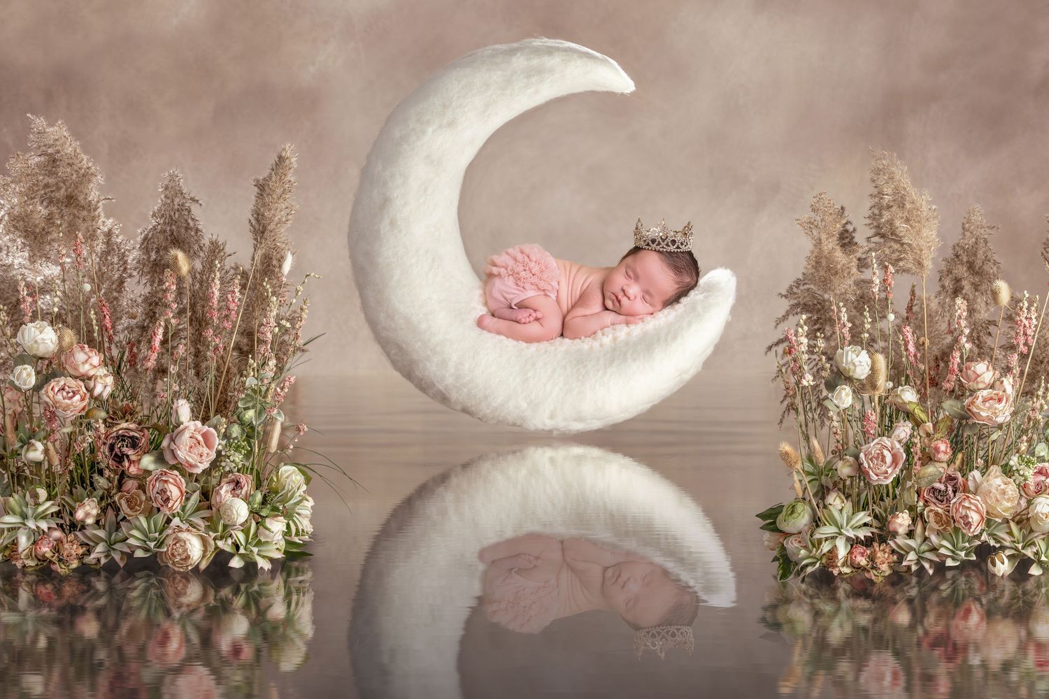 Soft white moon prop with pink floral accents for newborn photography. San Diego Newborn Photographer