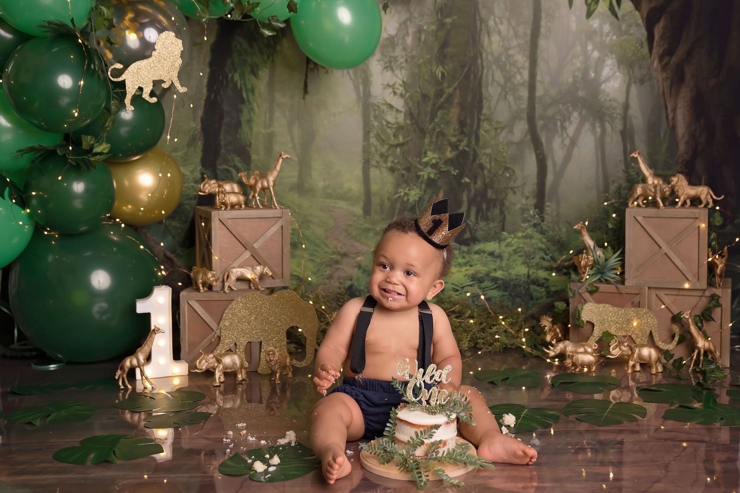 Enchanted forest photography setup with green lighting, woodland elements and magical atmosphere. San Diego cake smash photographer