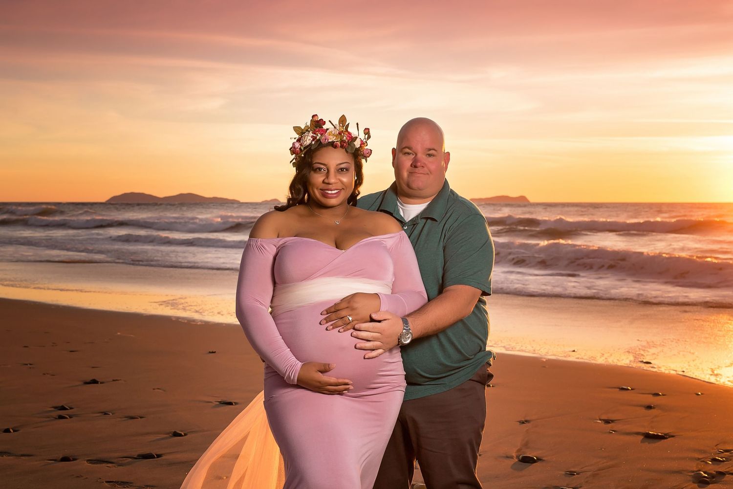 Sunset beach maternity photos with warm orange sky and ocean waves. San Diego Maternity Photographer