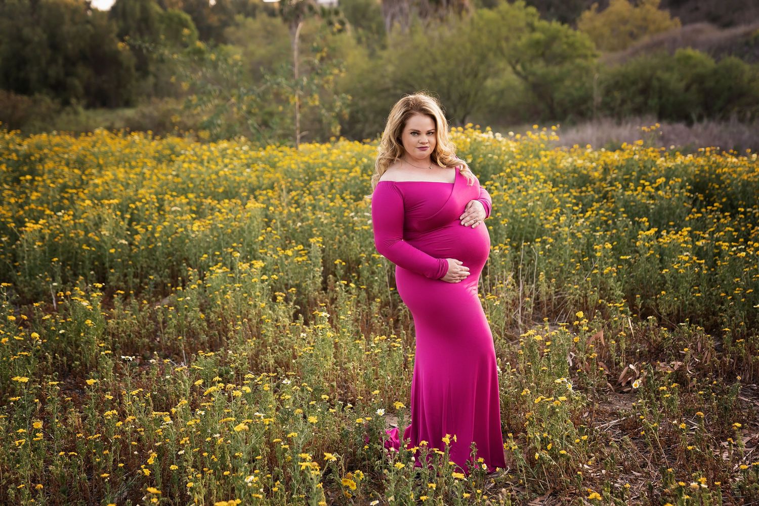 Wildflower field with yellow blooms against natural landscape. San Diego Maternity Photographer