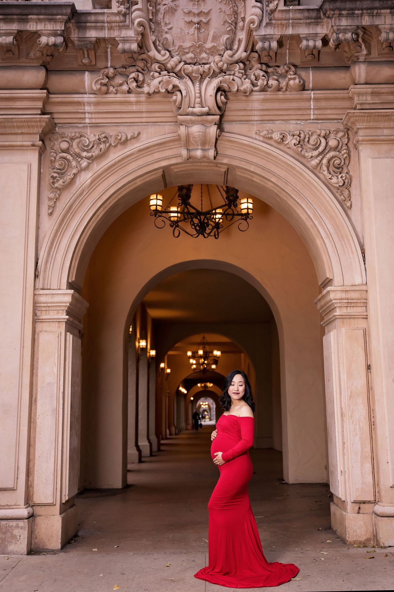 Ornate stone archways and corridors with decorative lighting fixtures. San Diego Maternity Photographer