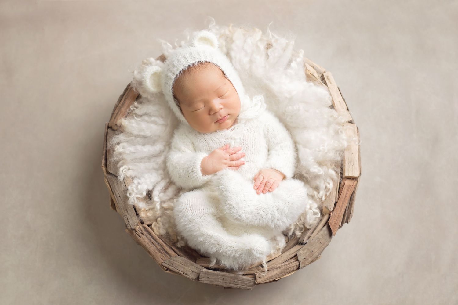 Series of newborn photography shots with baby nestled in white blankets and rustic baskets. San Diego Newborn Photographer